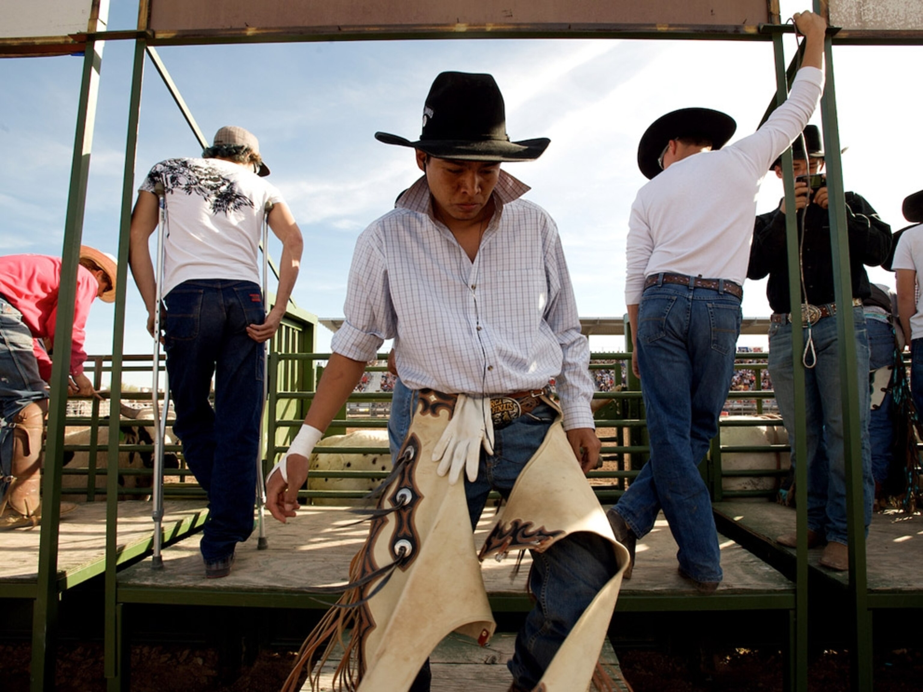 A man leaving a rodeo gate