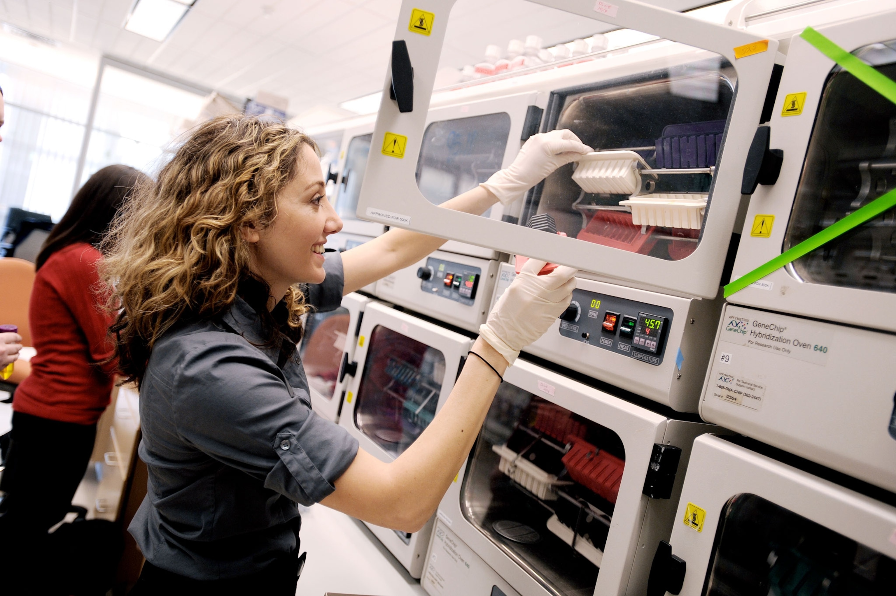 Pardis studying genomes in a lab