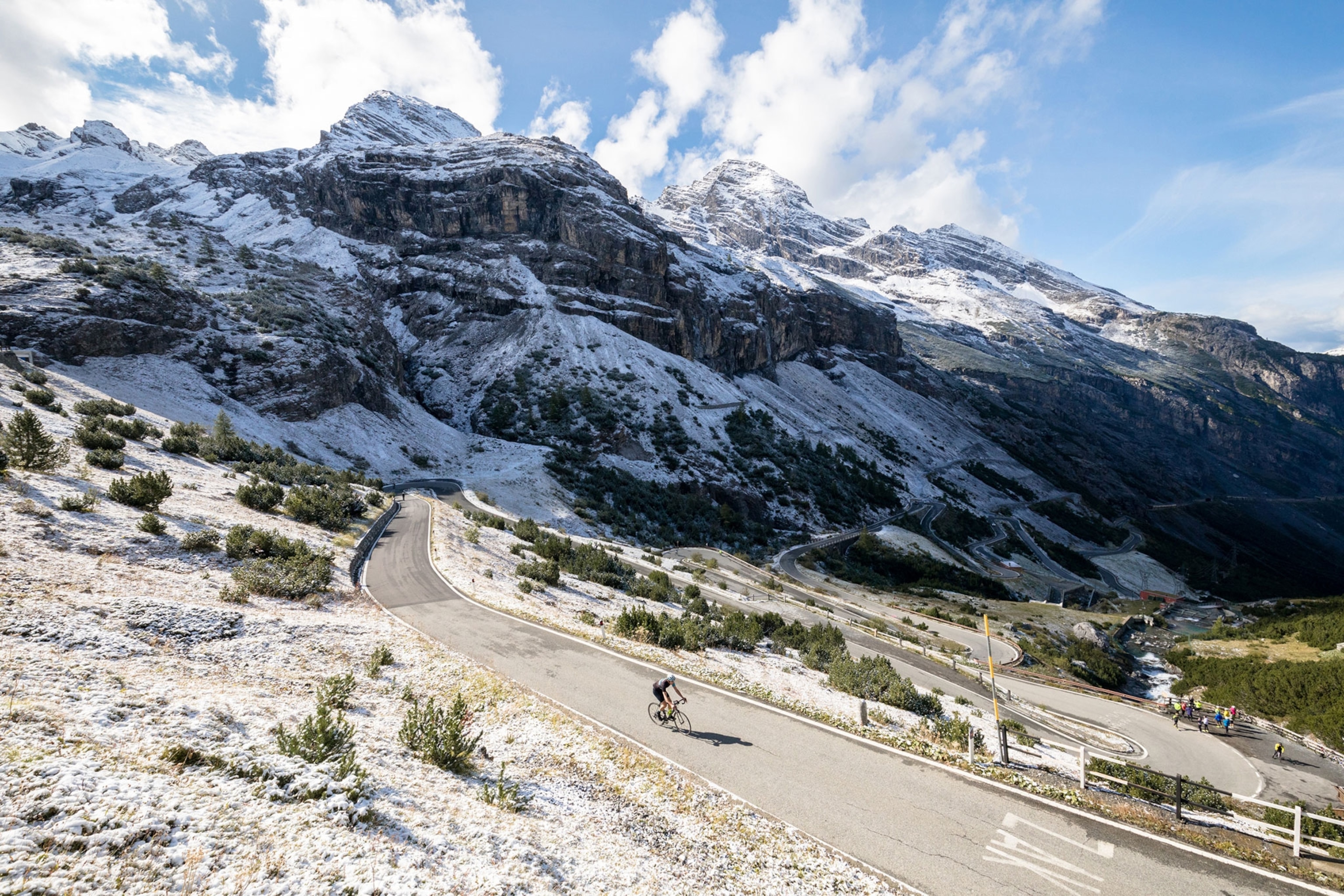 a cyclist riding through the Stelvio Pass in Italy