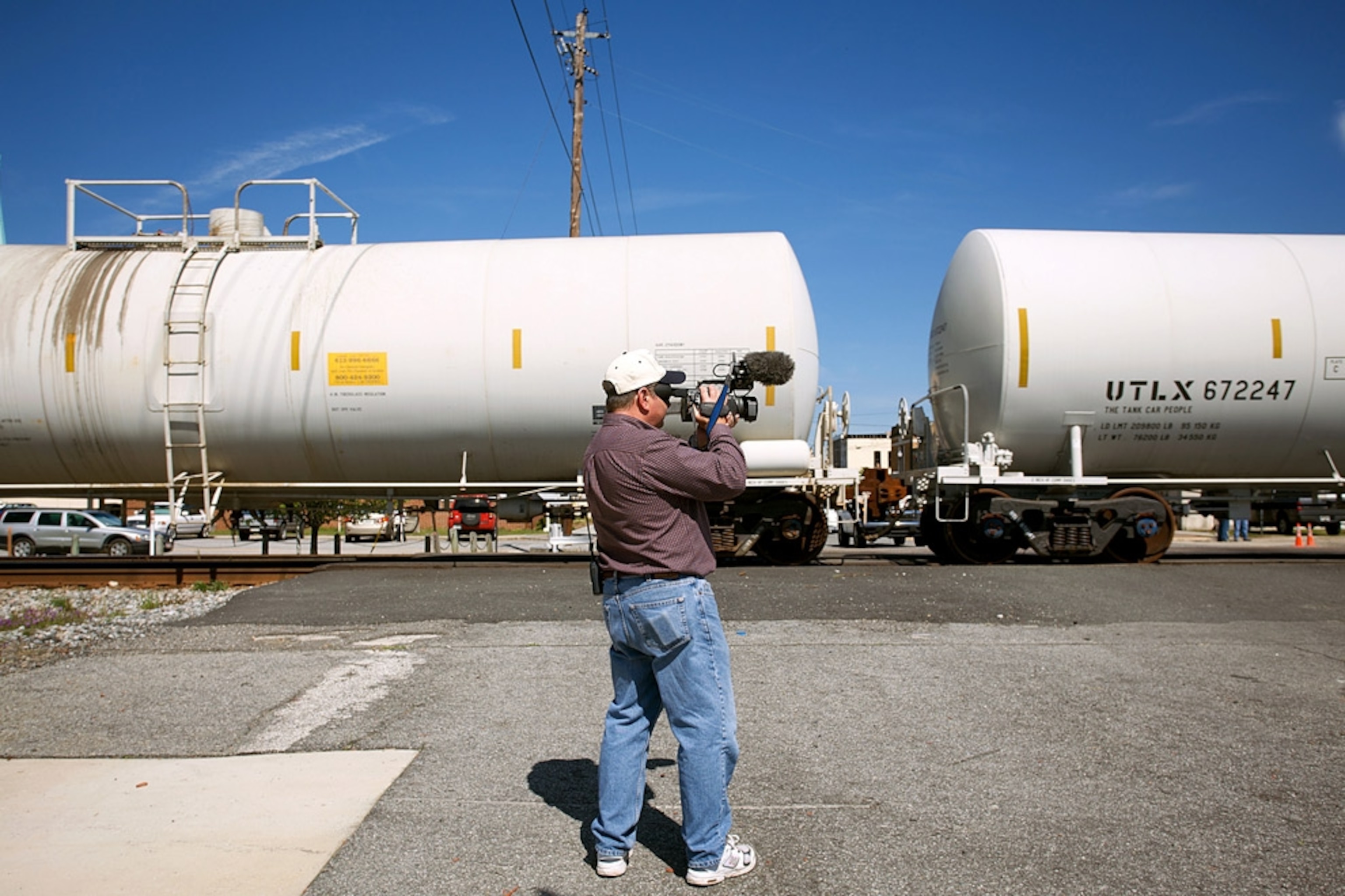 Man videotaping train