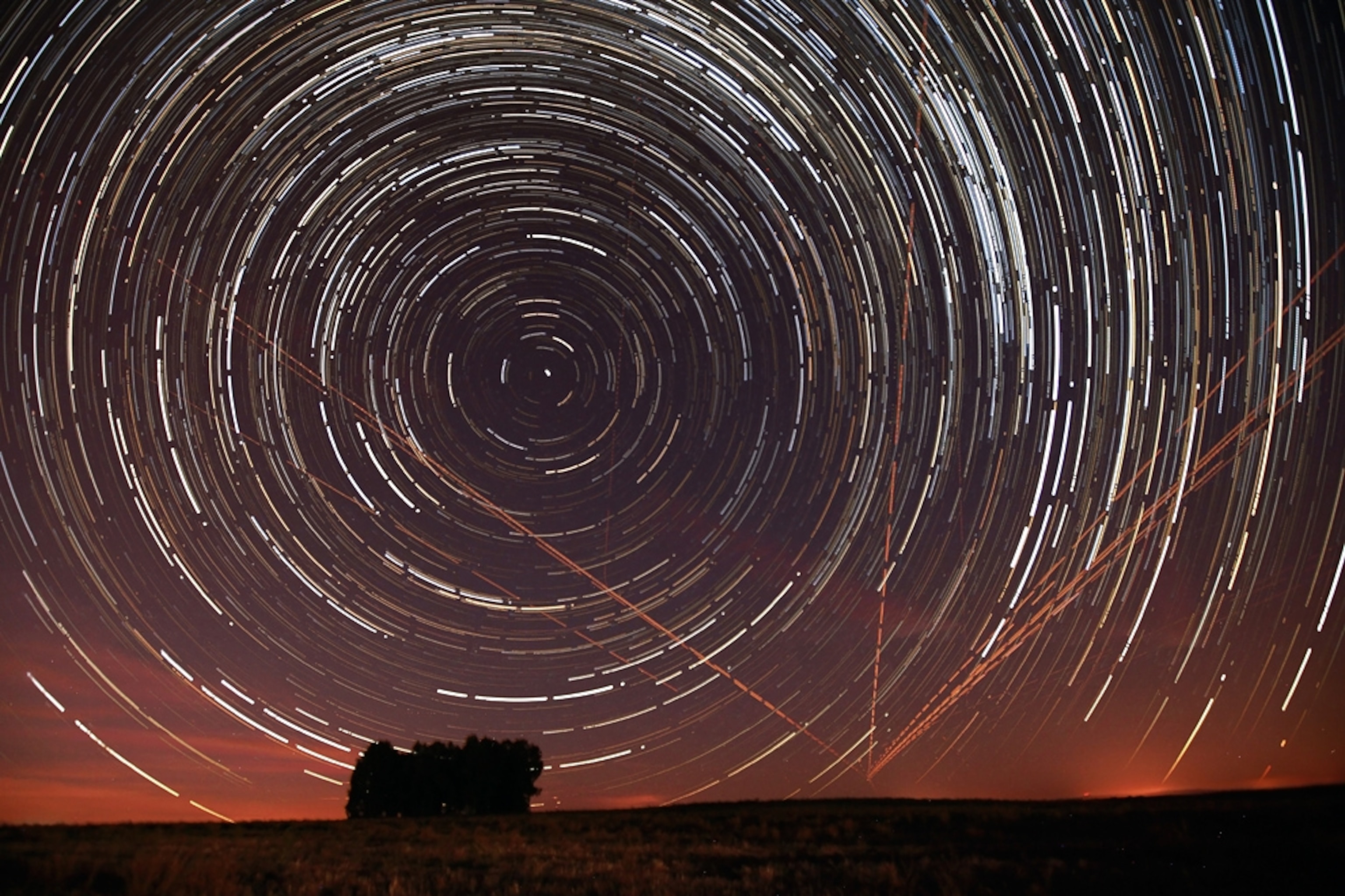 Stars picture: star trails cut by airplane routes in the sky over Portugal