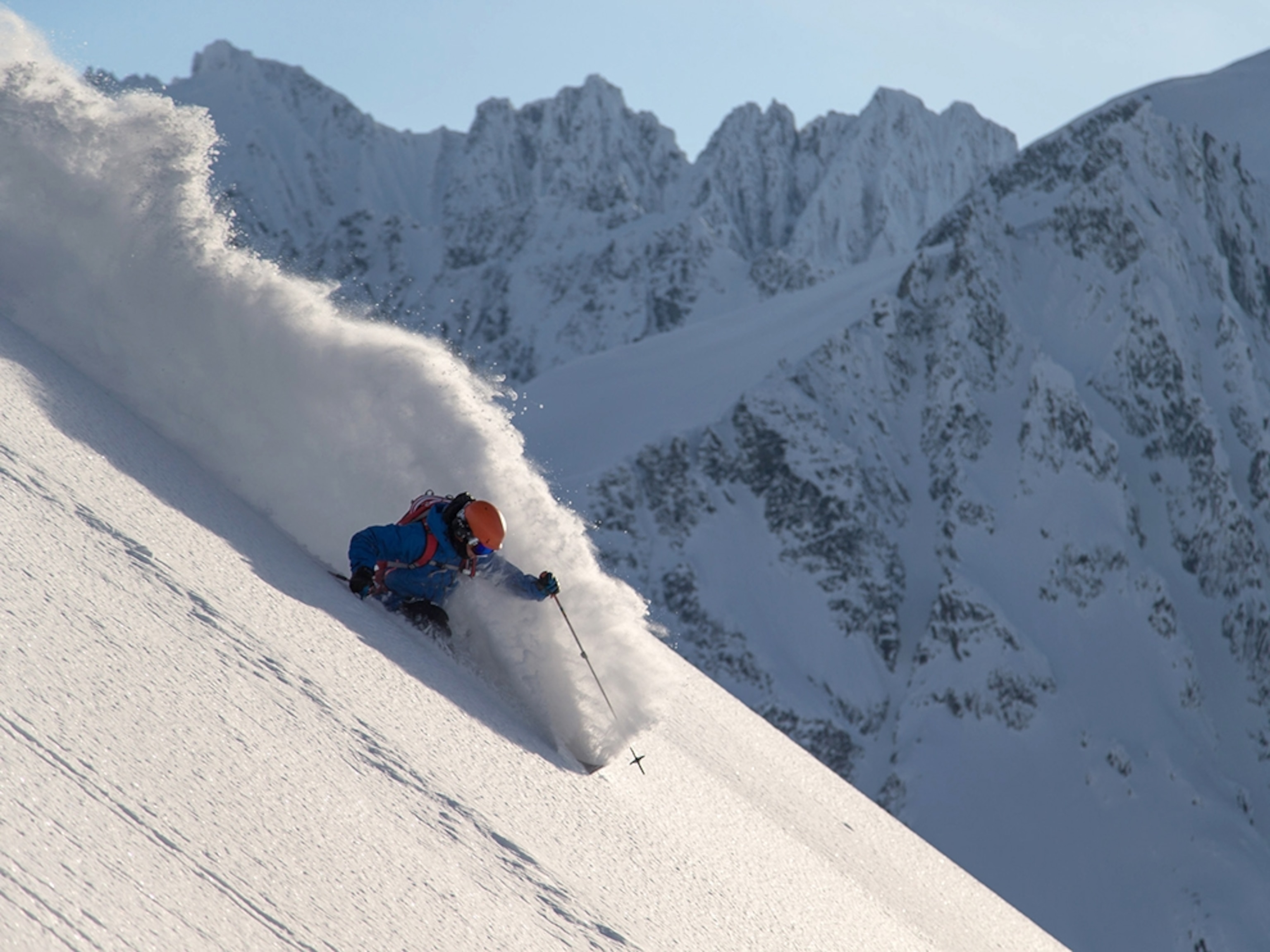 a man skiing down a mountain in Alaska