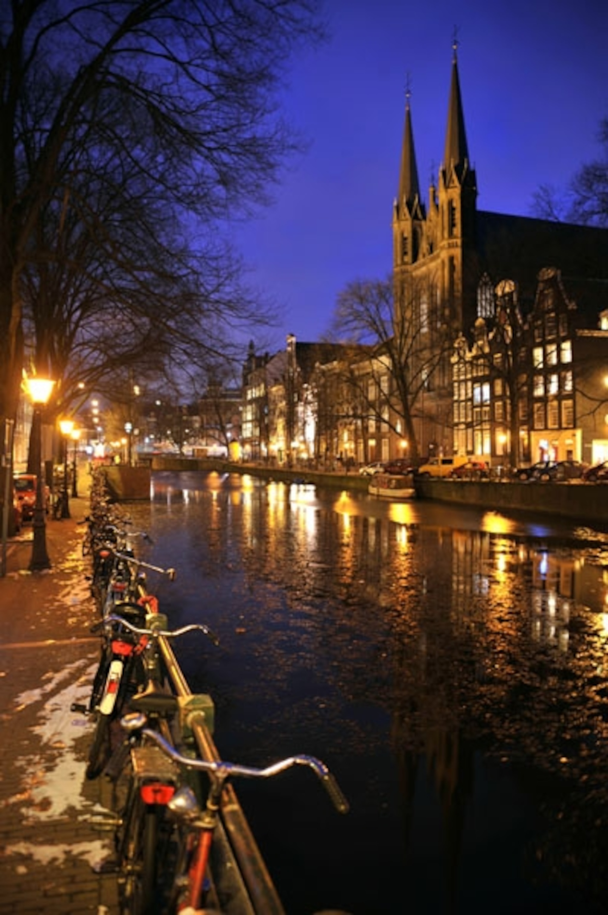Canal lined with bikes in Amsterdam, Netherlands