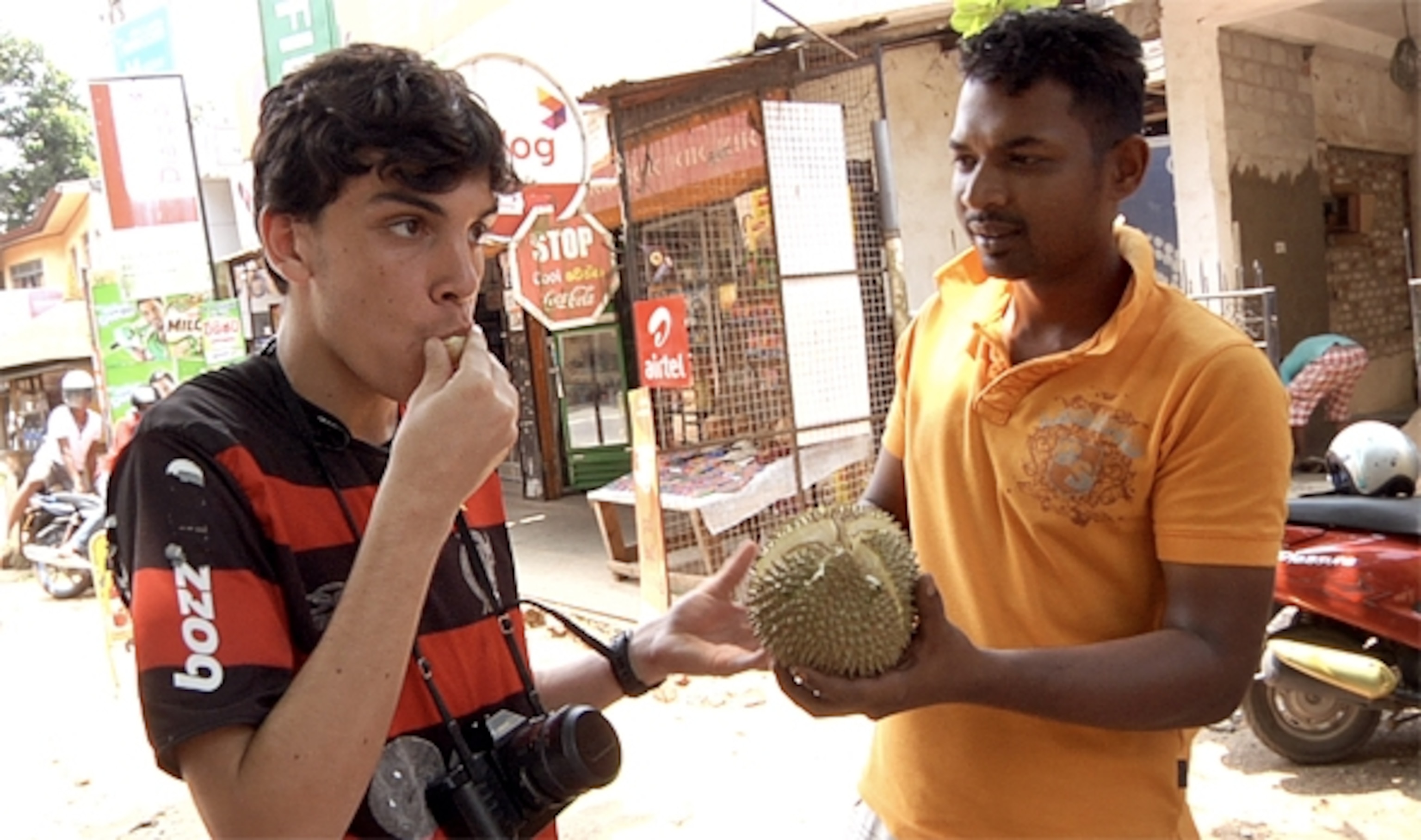 Booker sampling some Sri Lankan fruit. (Photograph by Tania Cypriano)