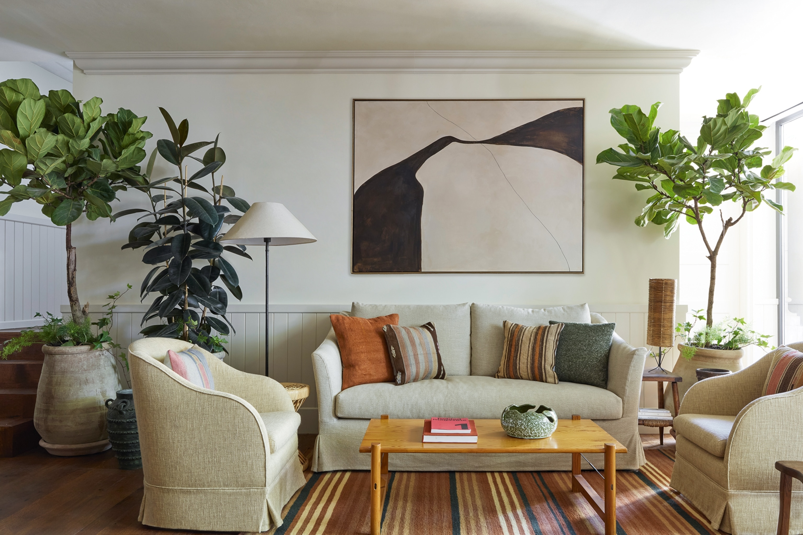 A mid-century modern meets country chic seating area in a hotel lobby.