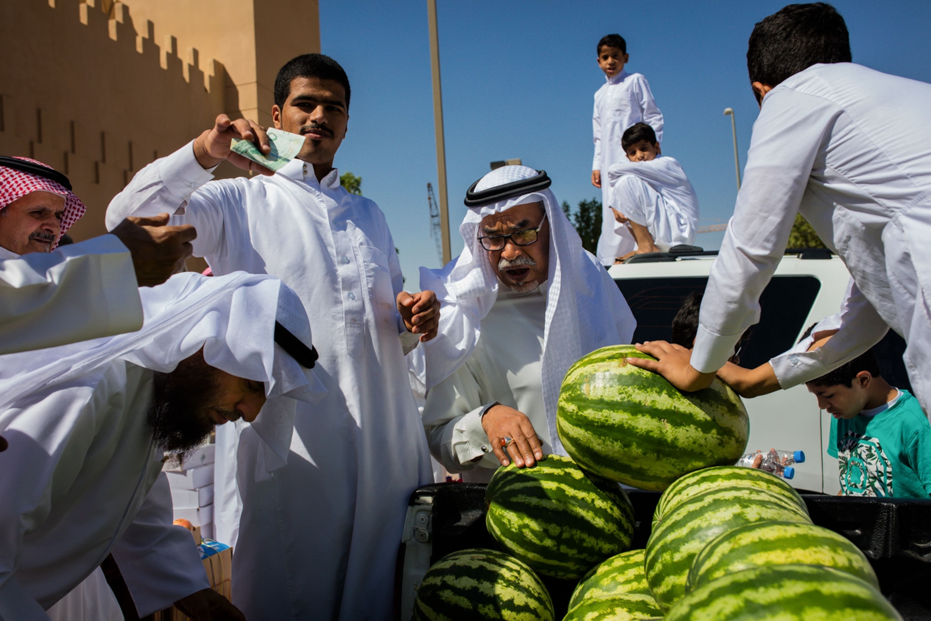men buying watermelons in Saudi Arabia