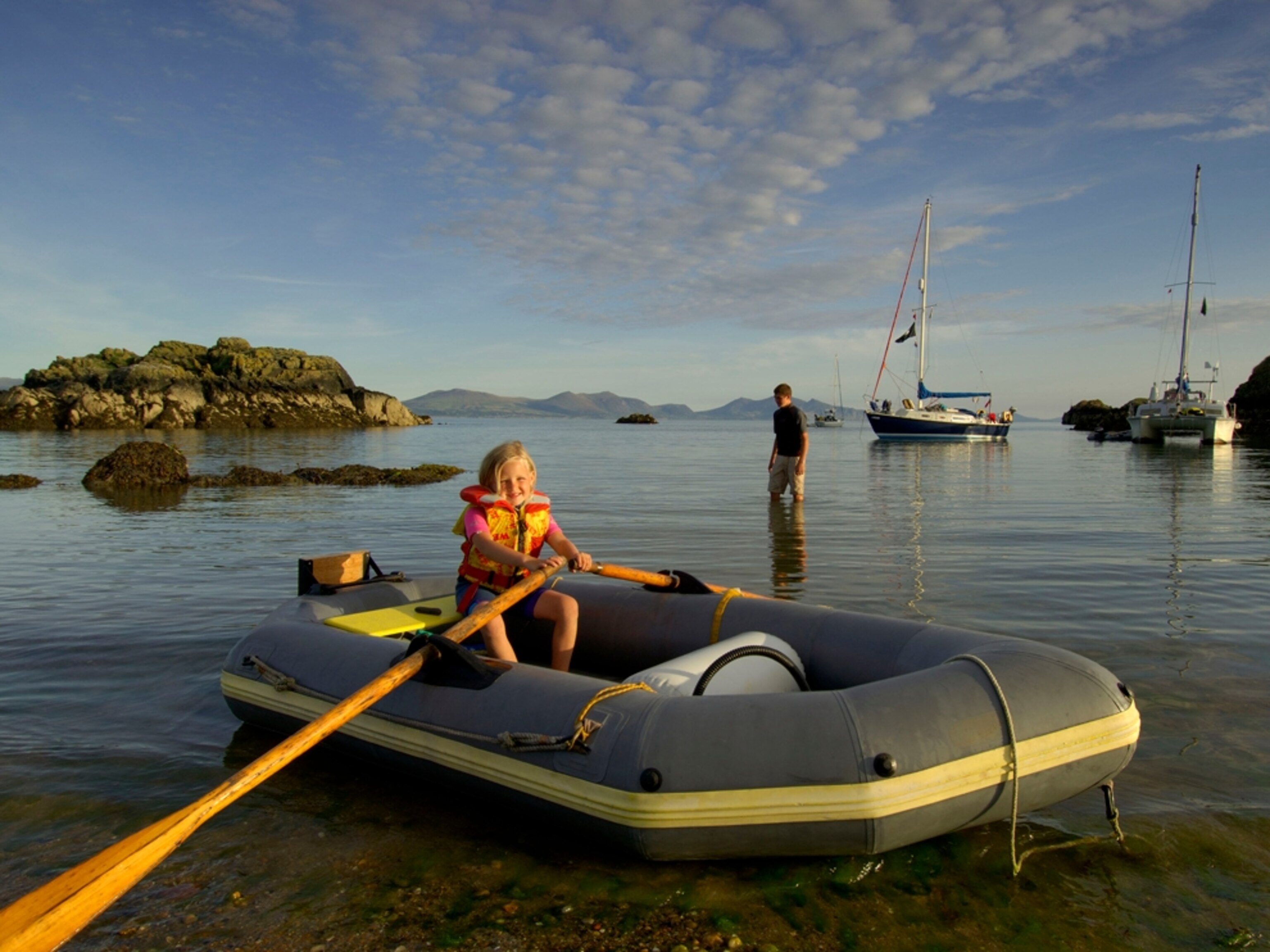Girl in rowboat on Llanddwyn Island, North Wales