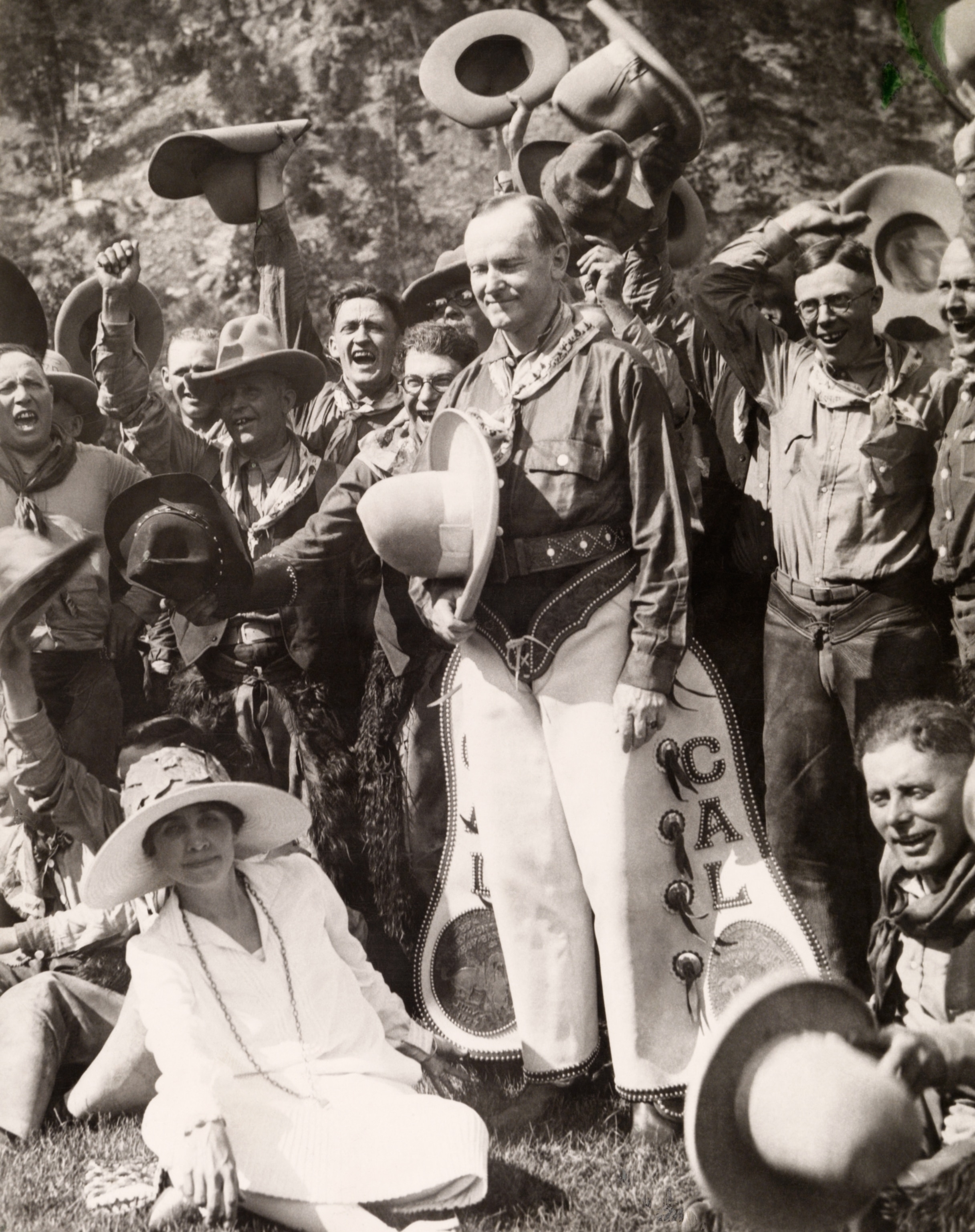 Calvin Coolidge, dressed as a cowboy, poses with others celebrating the Fourth in South Dakota.