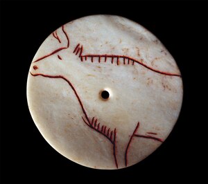 This cow bone and iron etching is a replica of a Magdalenian-era artifact found at the Cave of Mas-d'Azil in France.