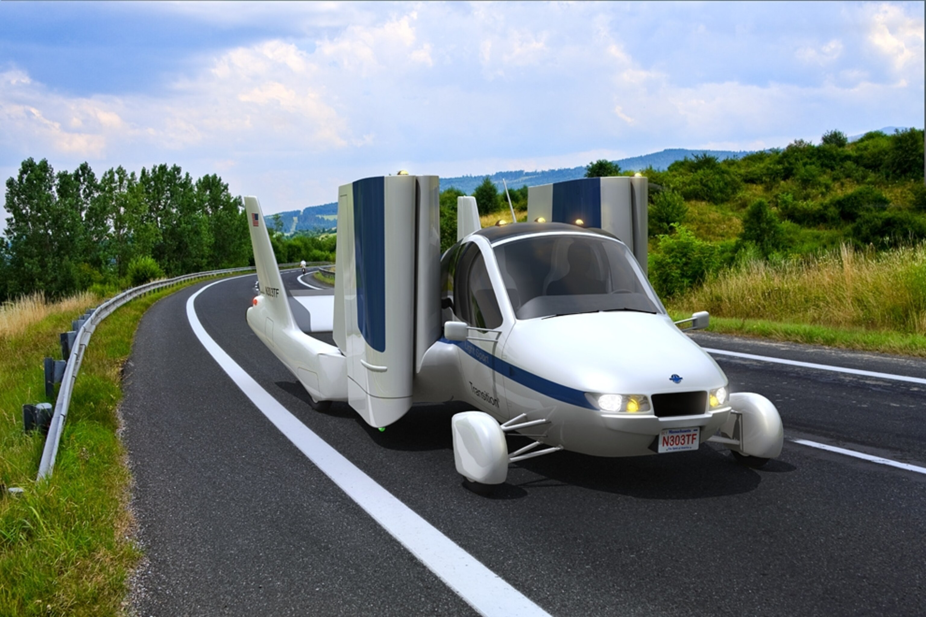 a Terrafugia Transition flying car driving down a road