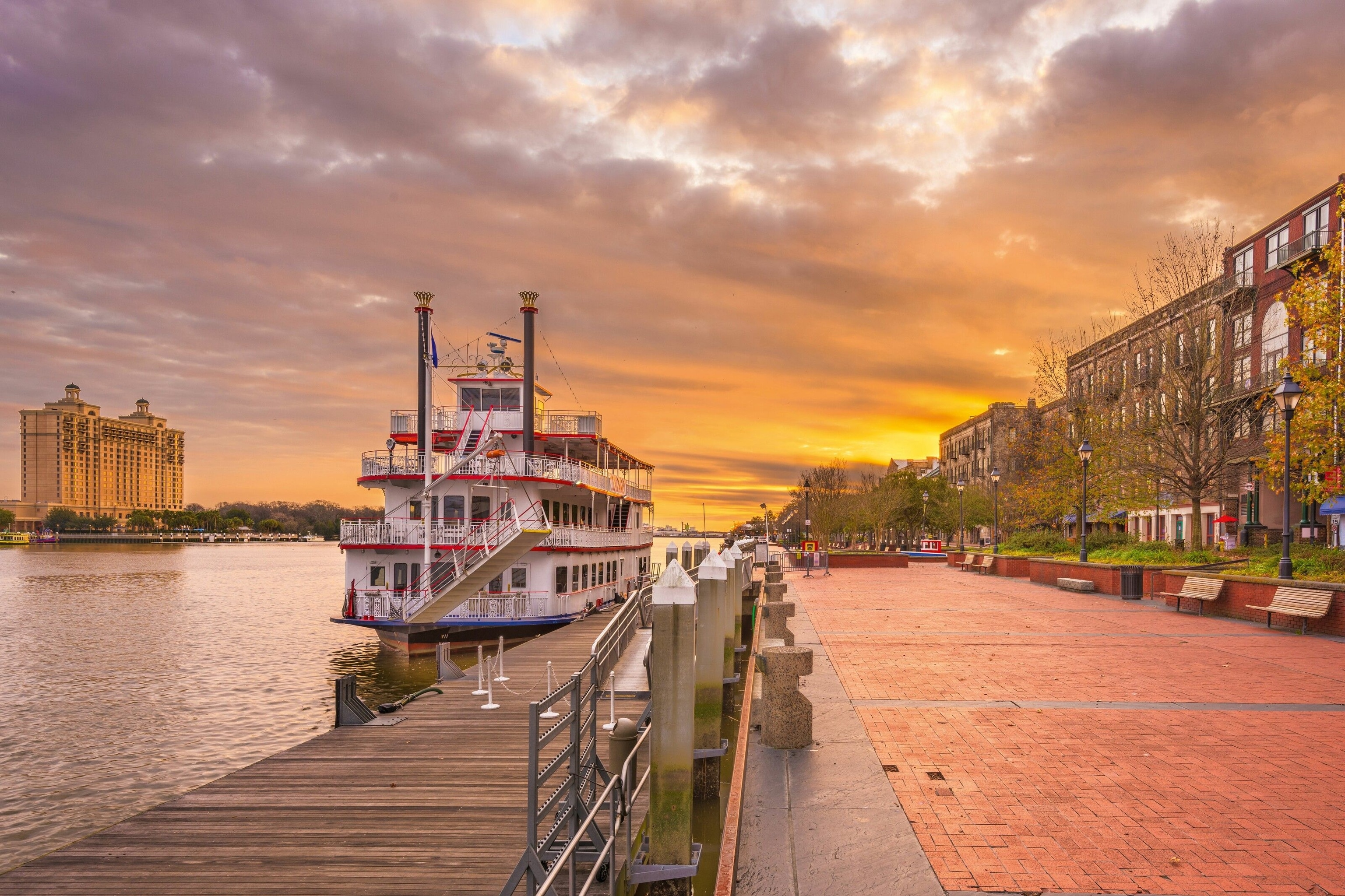 Riverfront promenade with steamboats at sunrise, Savannah.