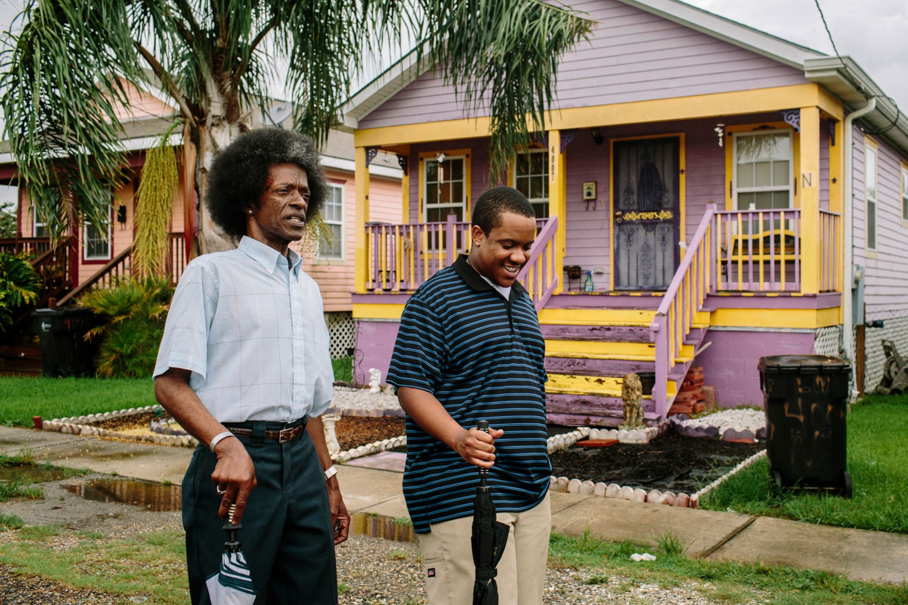the Harris' walking through Musicians' Village in New Orleans