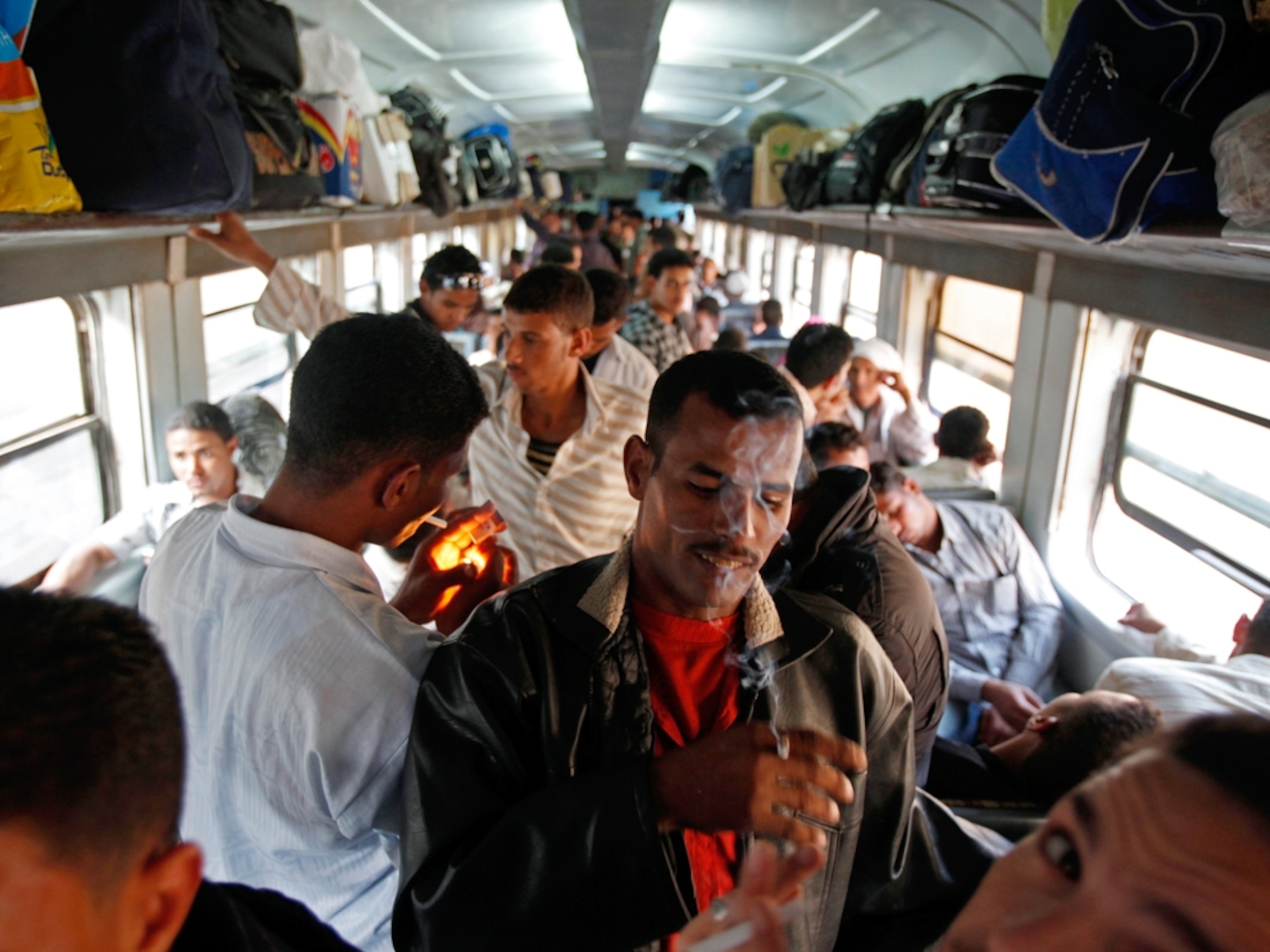 Passengers stand on a crowded Egyptian train