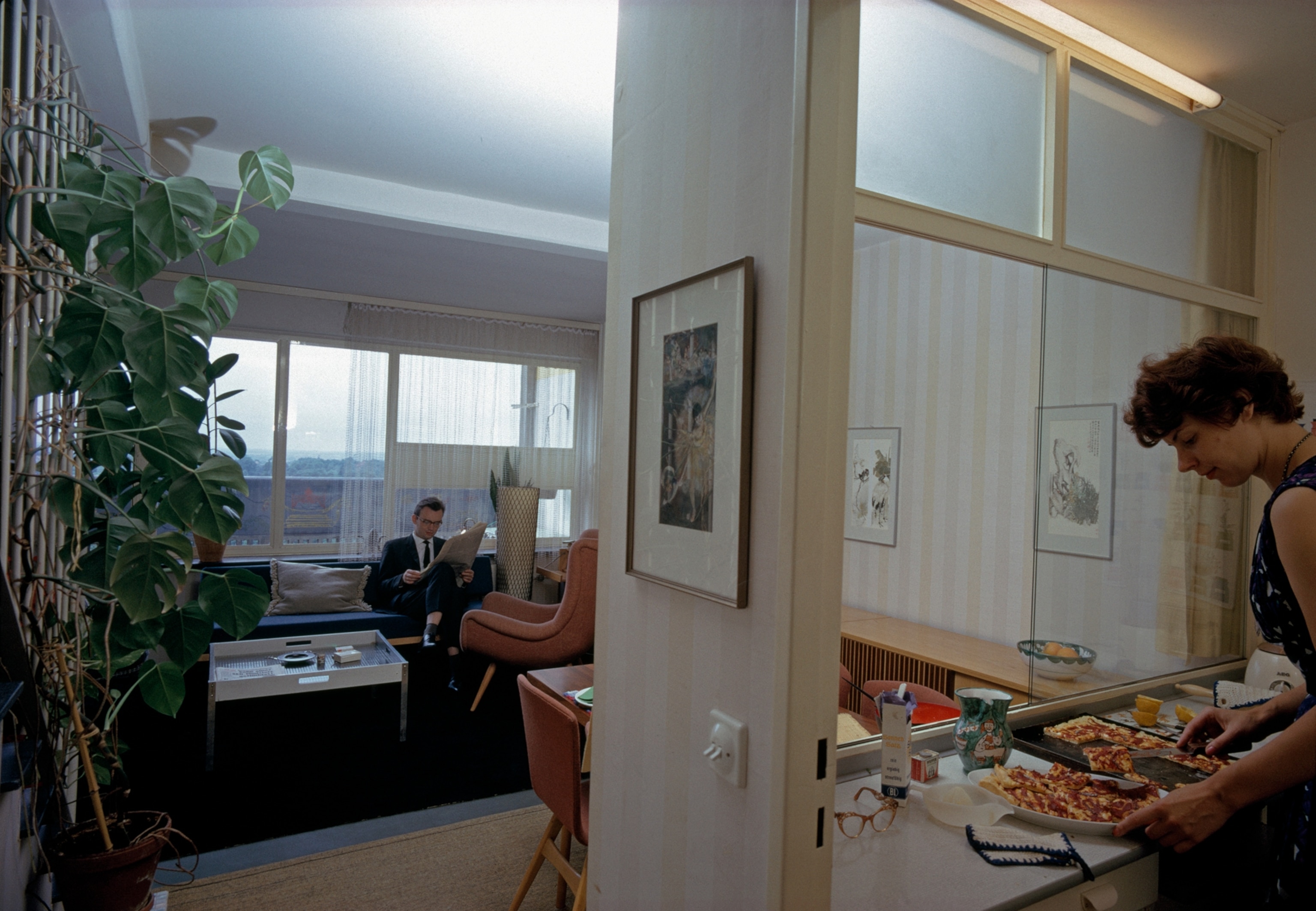 Inviting flat typifies those in the Corbusierhaus, named for the Paris architect who designed it, Le Corbusier. Berlin's largest apartment building, the 17-floor structure contains a shopping center and its own power station.