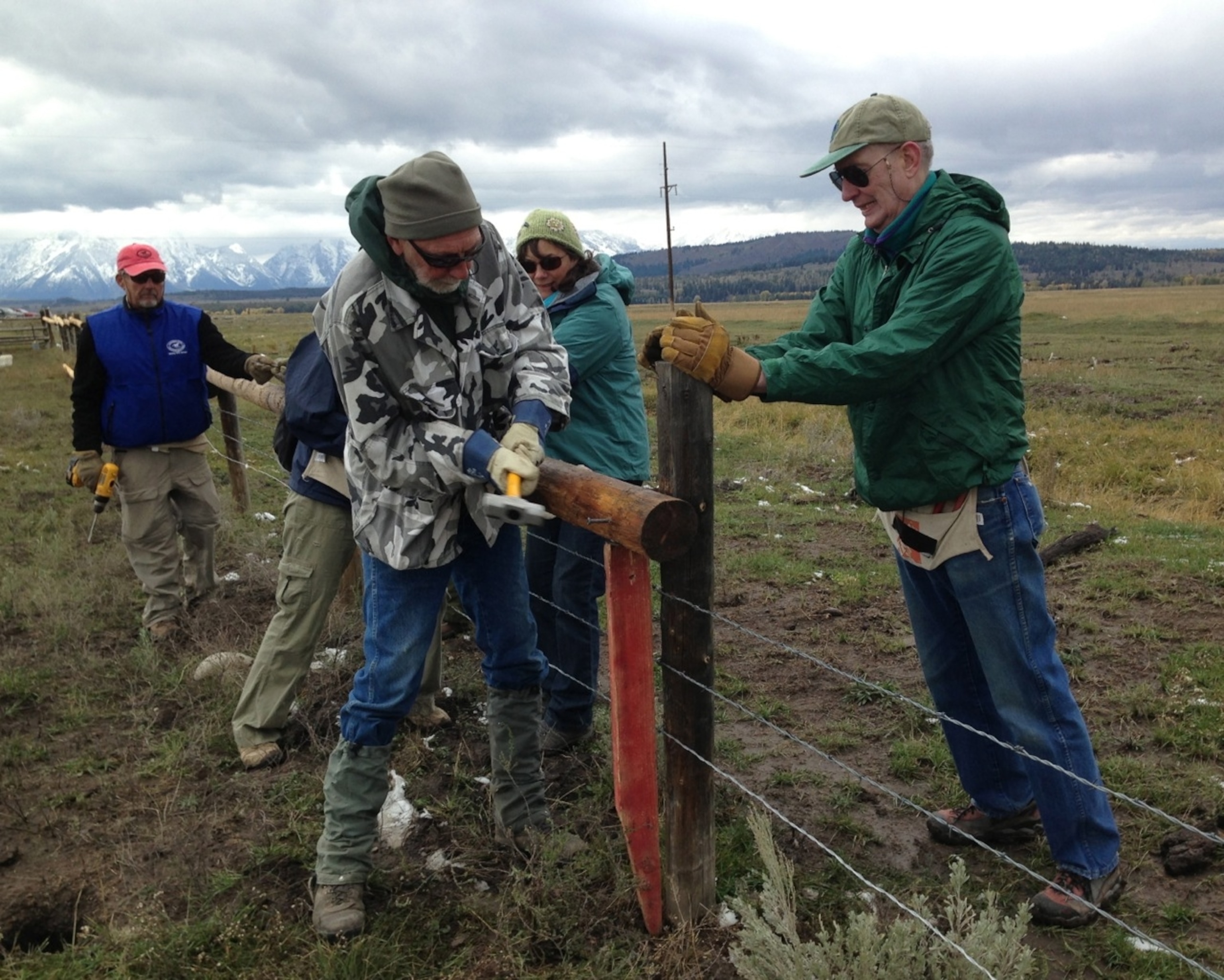 Many hands make light work as part of Nature Valley's Preserve the Parks volunteer project modifying ranching fences in Grand Teton National Park. (Photo by Andrew Evans, National Geographic Traveler)