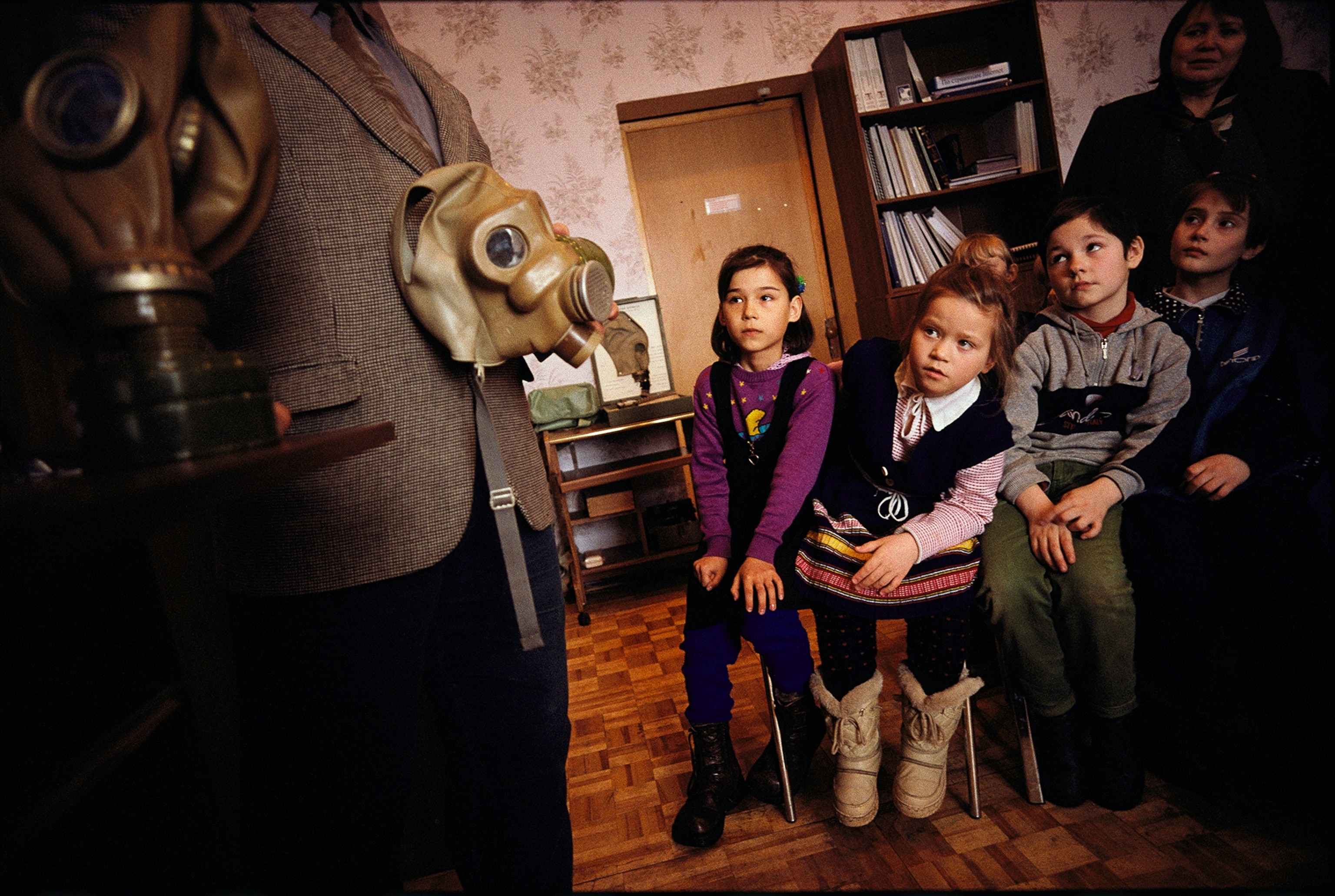 Teaching Russian second graders how to prepare for a chemical attack.