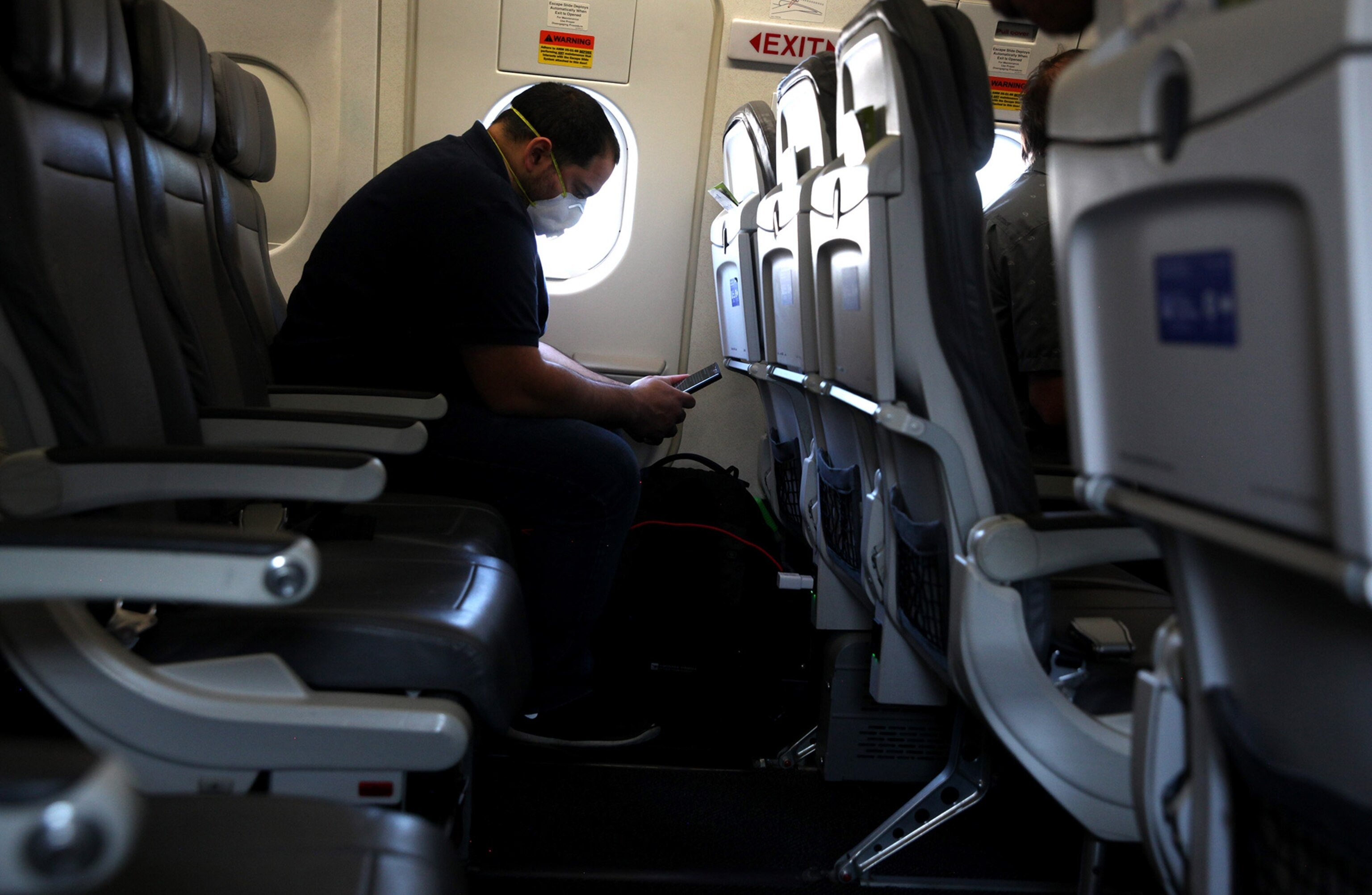 a passenger in a window seat on a flight