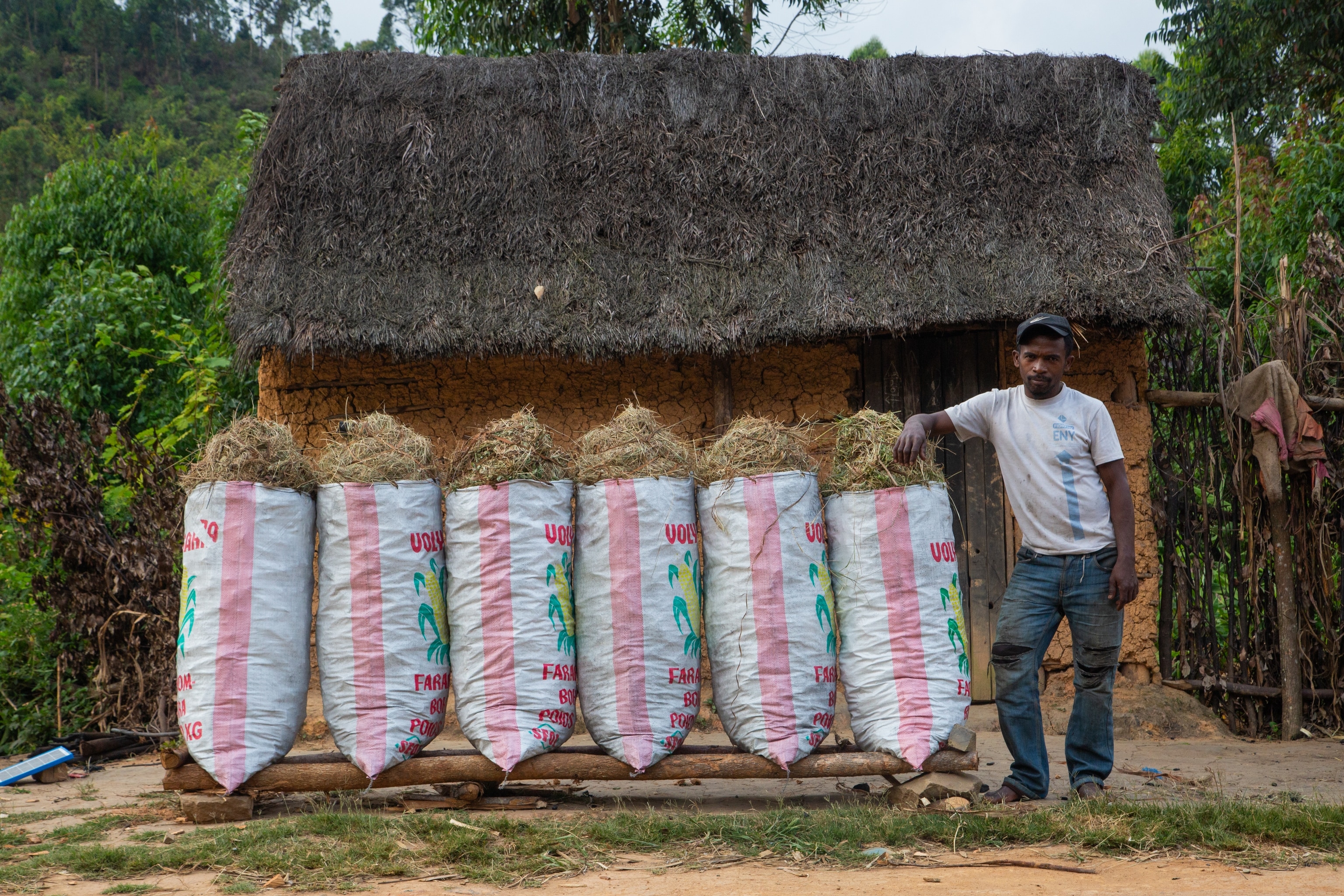 A charcoal seller shows its merch on Route Nationale 2 near Anevoka village, at the entrance of the Maromizaha Reserve.