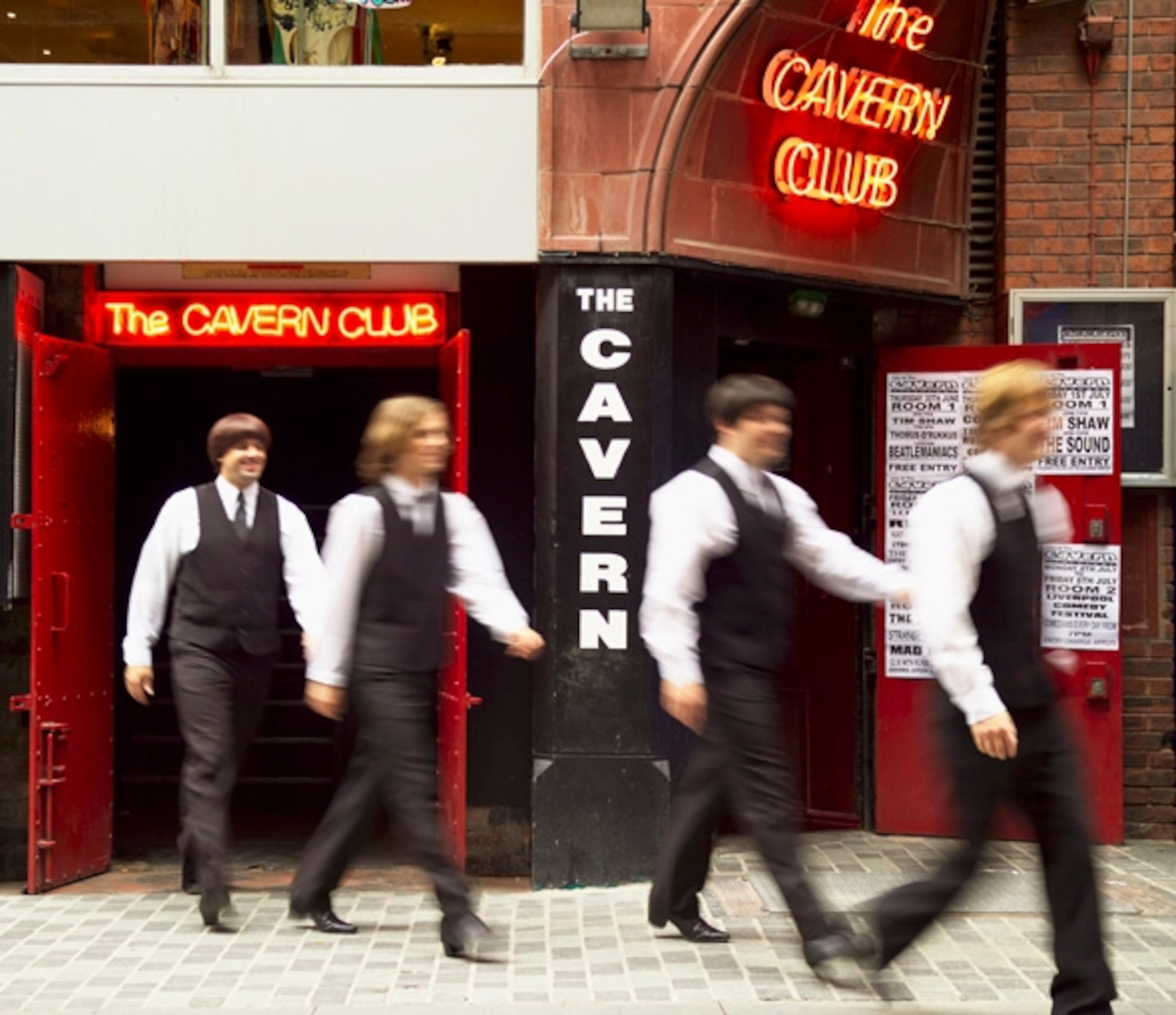 A Beatles tribute band outside the Cavern Club.  (Photograph by Pawel Libera, British Tourist Authority)