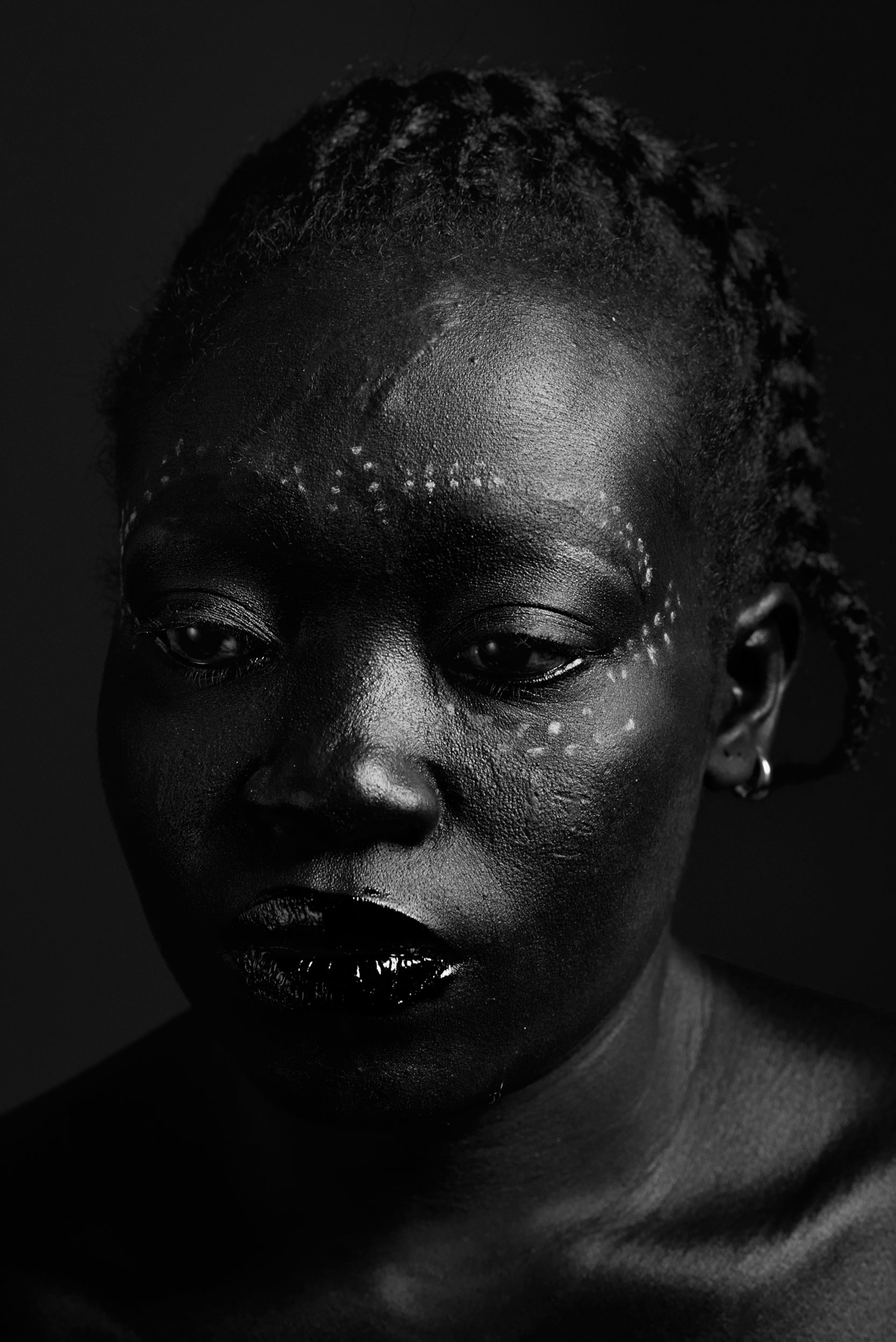 a woman with white markings around her eyes