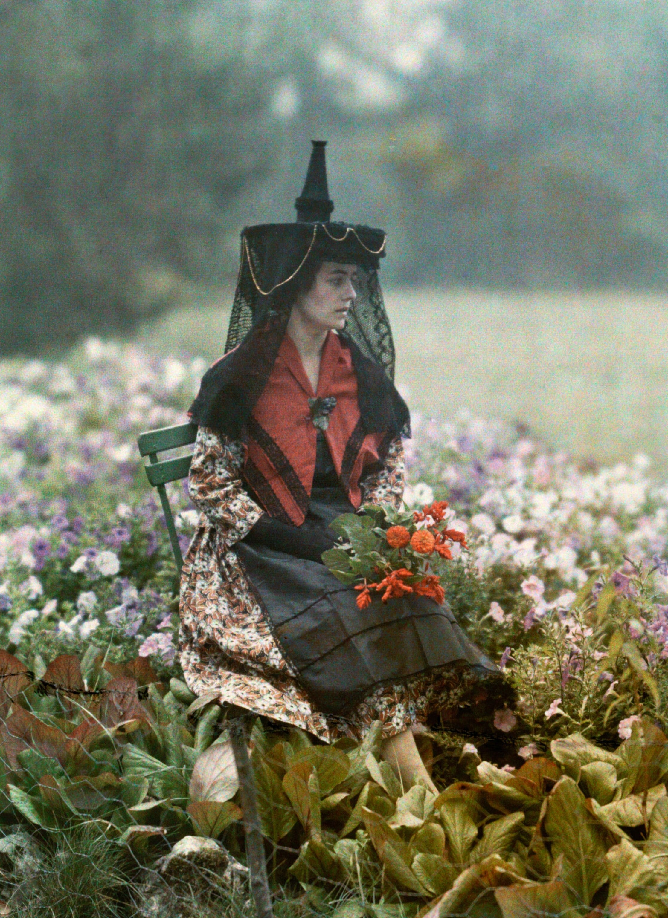 woman in headdress of burgundy