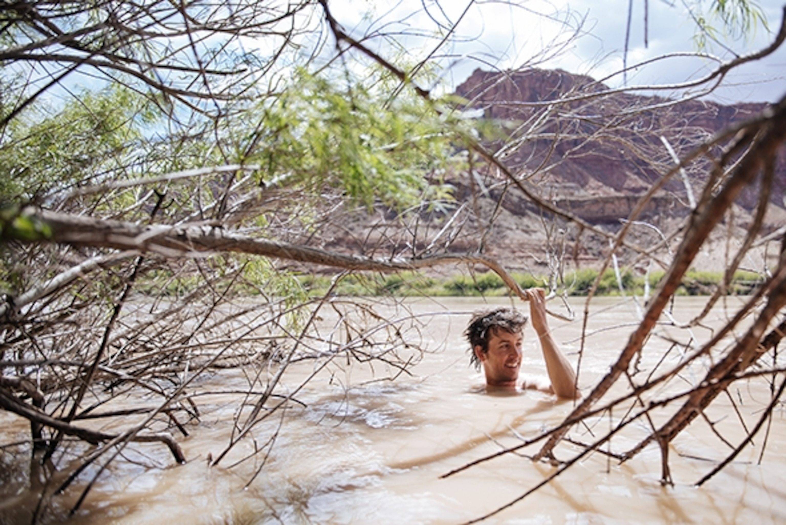 Joey Schusler takes a dip in the Green River; Photograph by Max Lowe