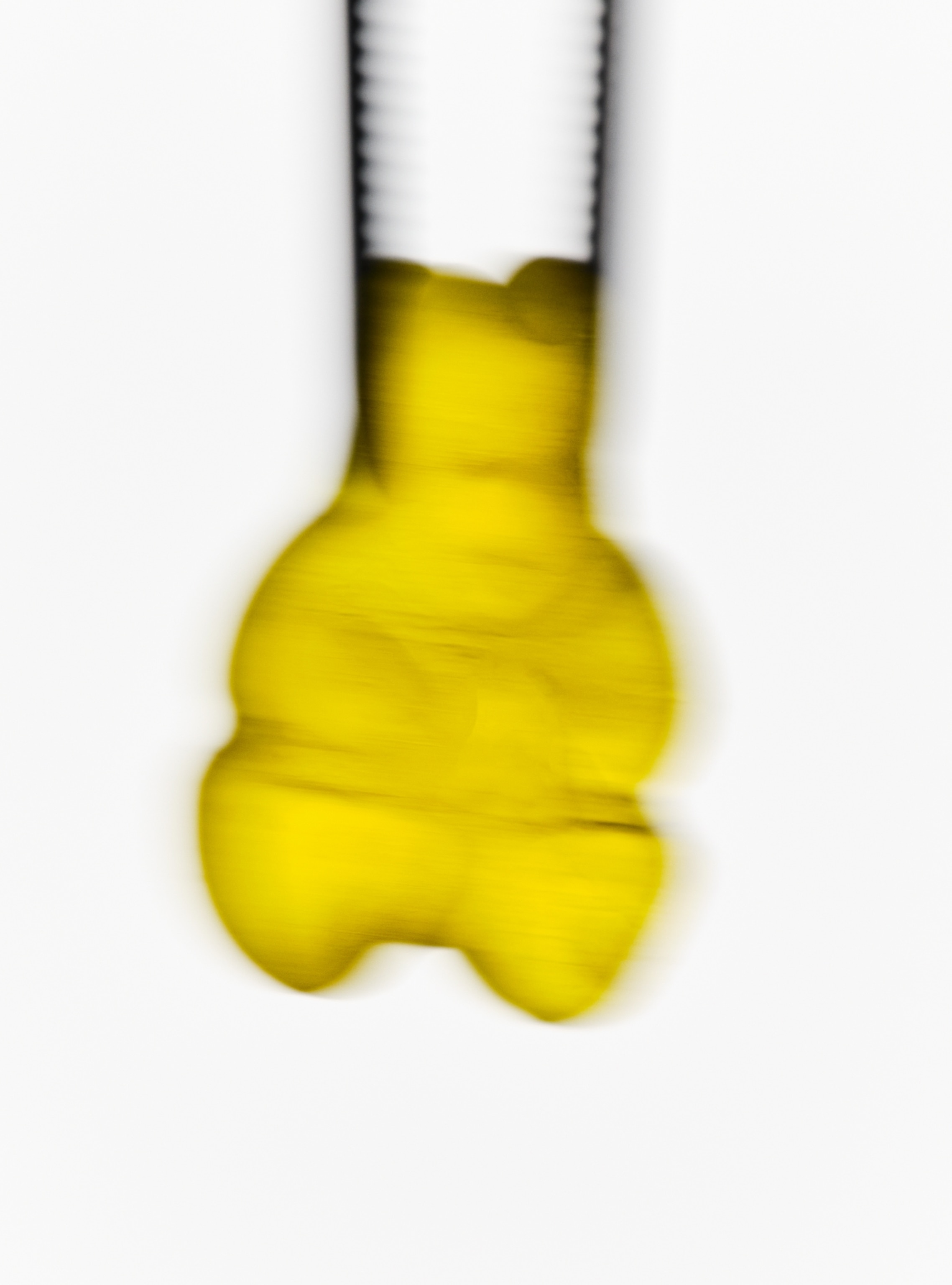 Blurry picture of yellow gummy bear.