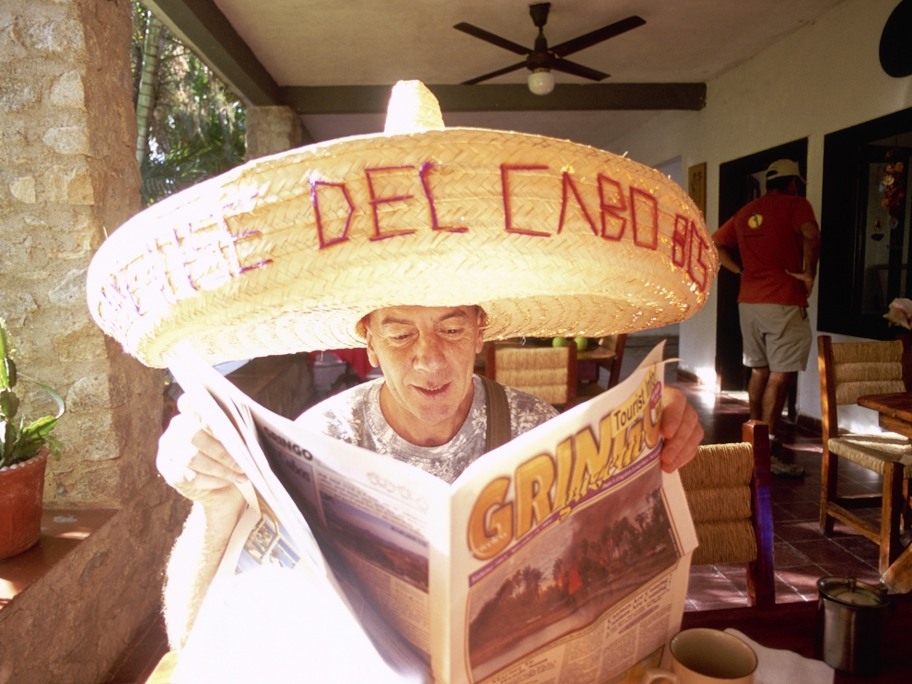Cabo Mexico reading newspaper