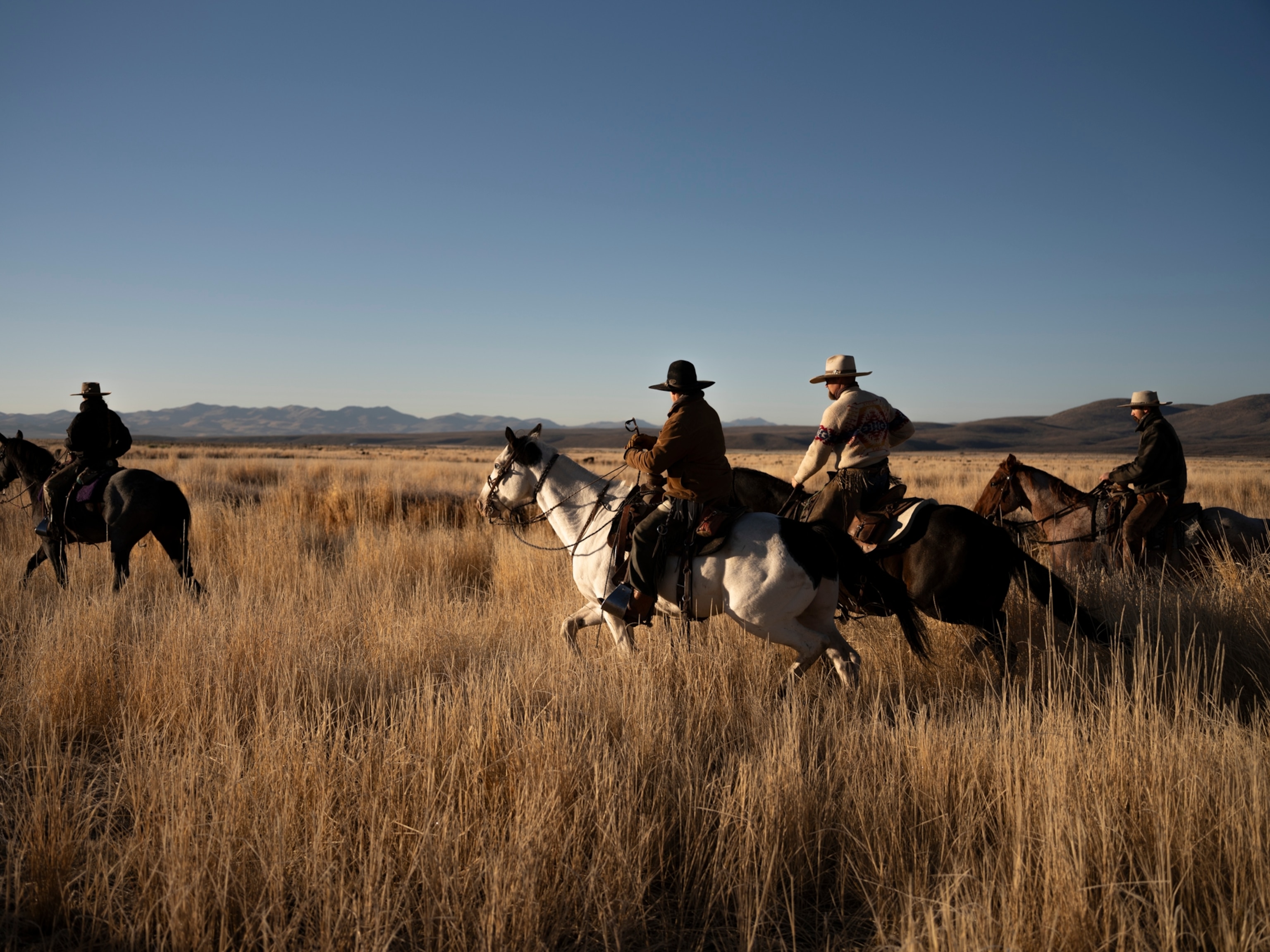 Cowboys on their horses at Spanish Ranch in Tuscarora, Nevada.