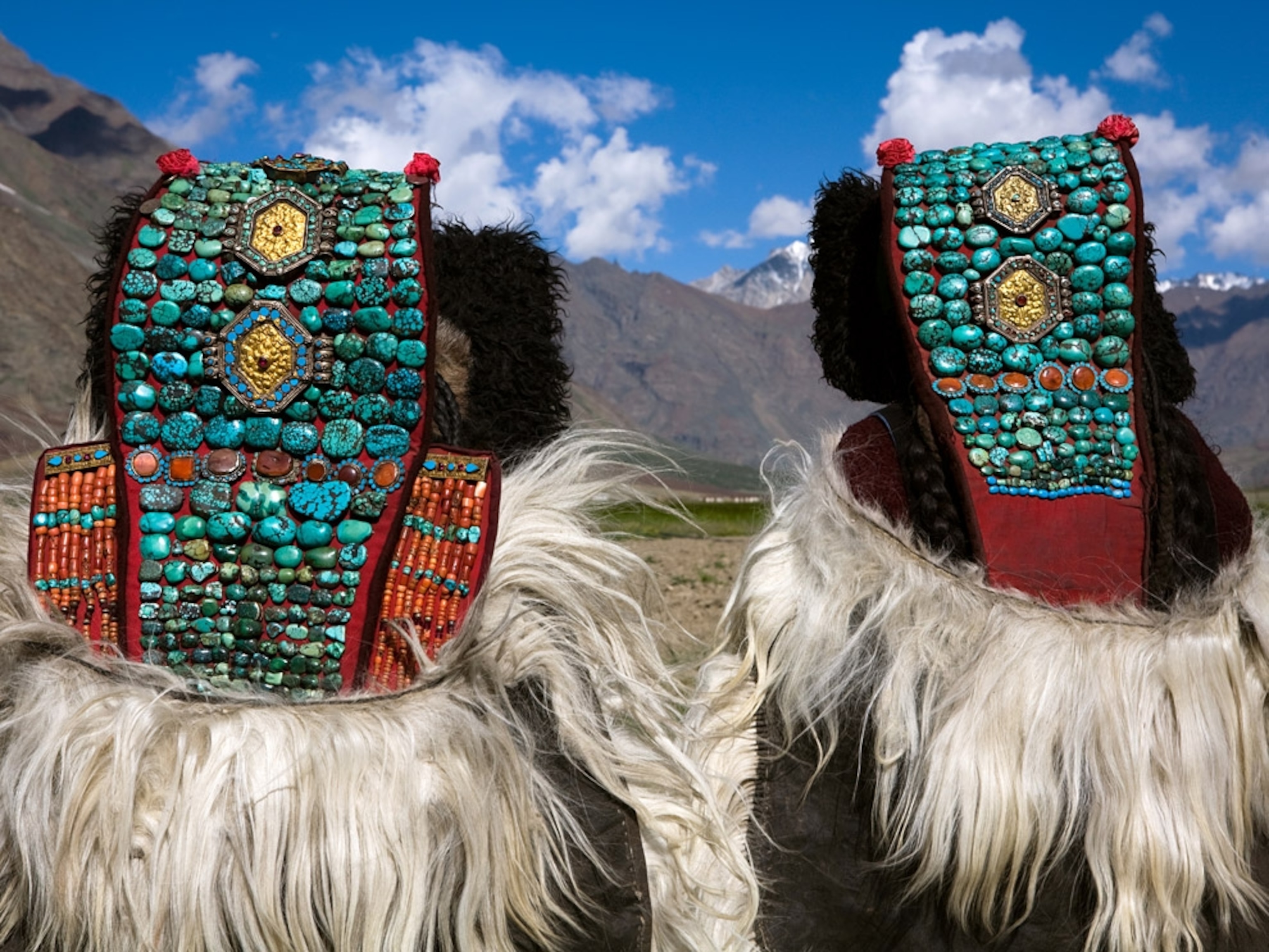 Women wearing elaborate headdresses