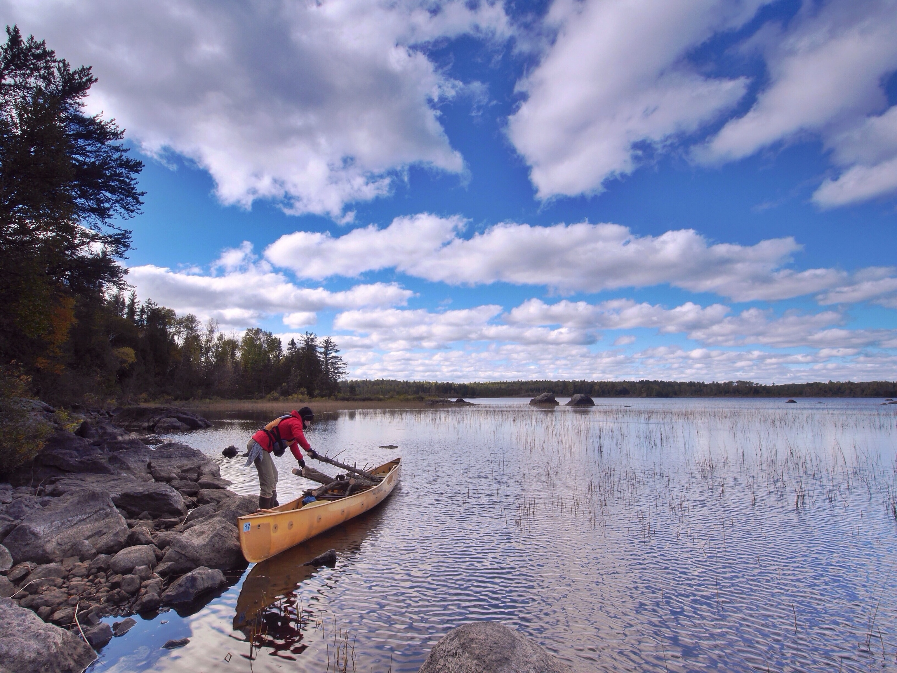 Dave and Amy Freeman regularly load their canoe with firewood, which they haul back to their campsite to burn in their woodstove.