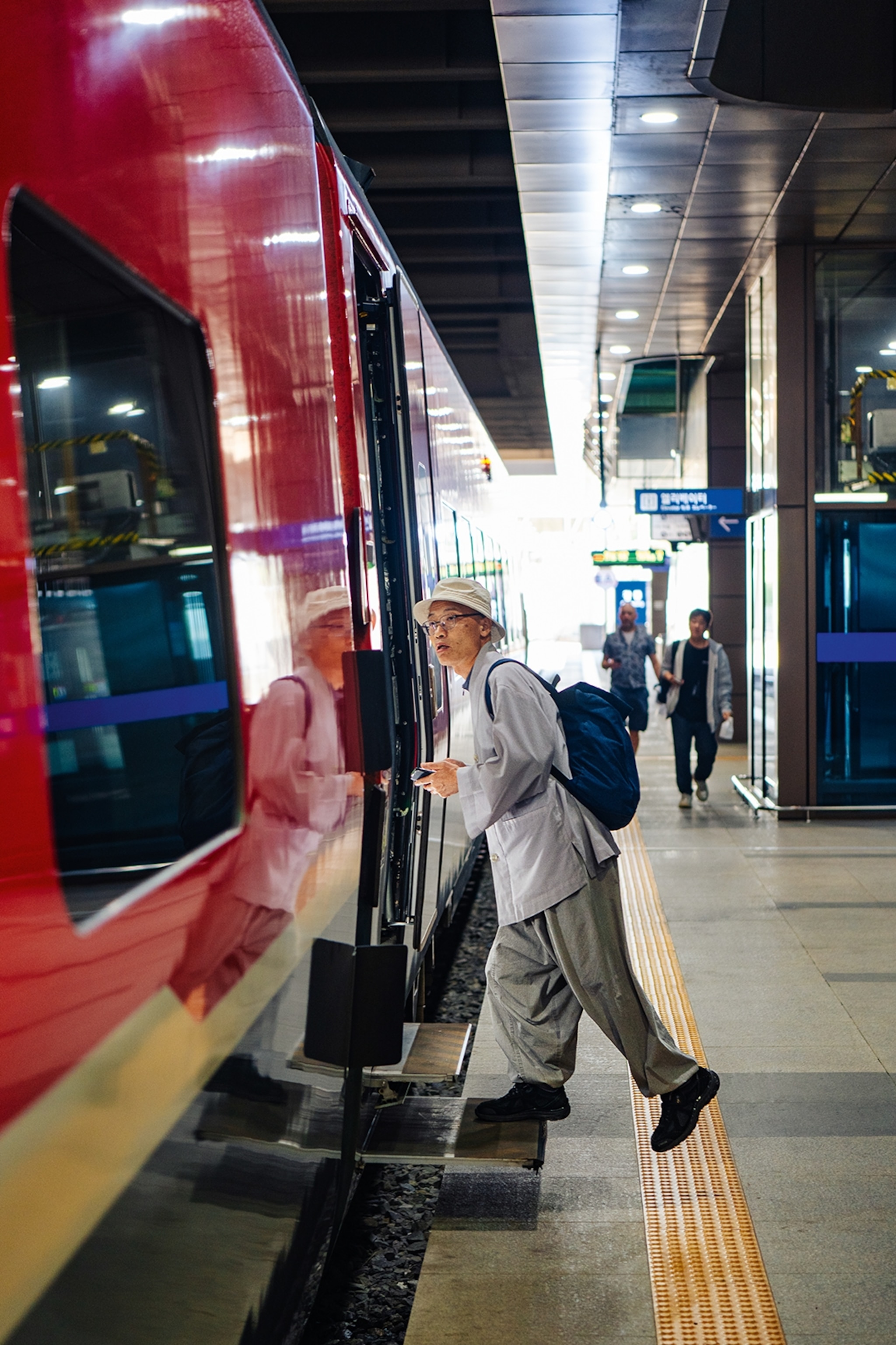 Man boards a train in South Korea.