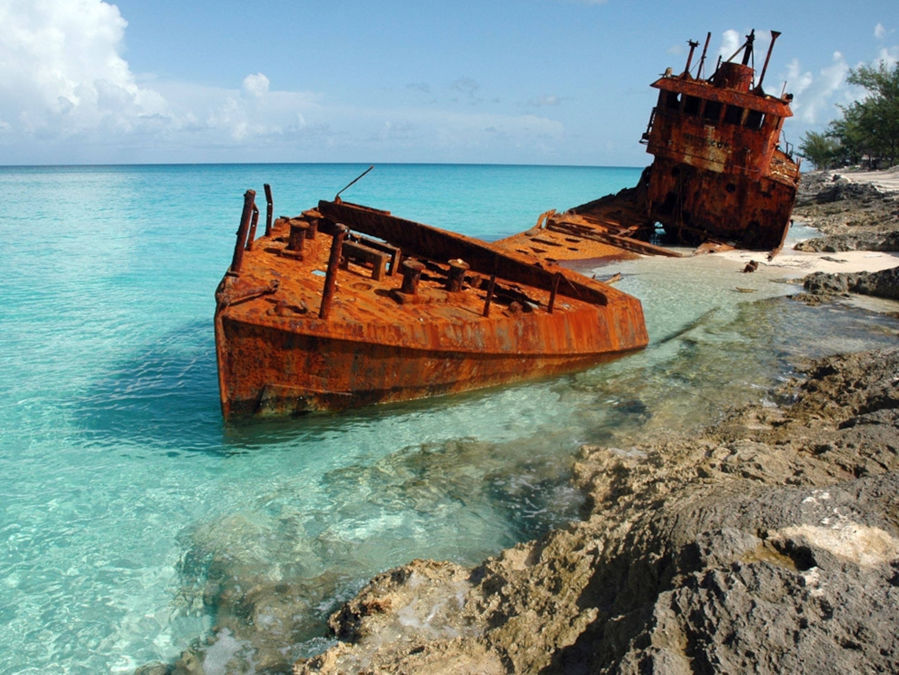 Rusted shipwreck on a Bimini beach