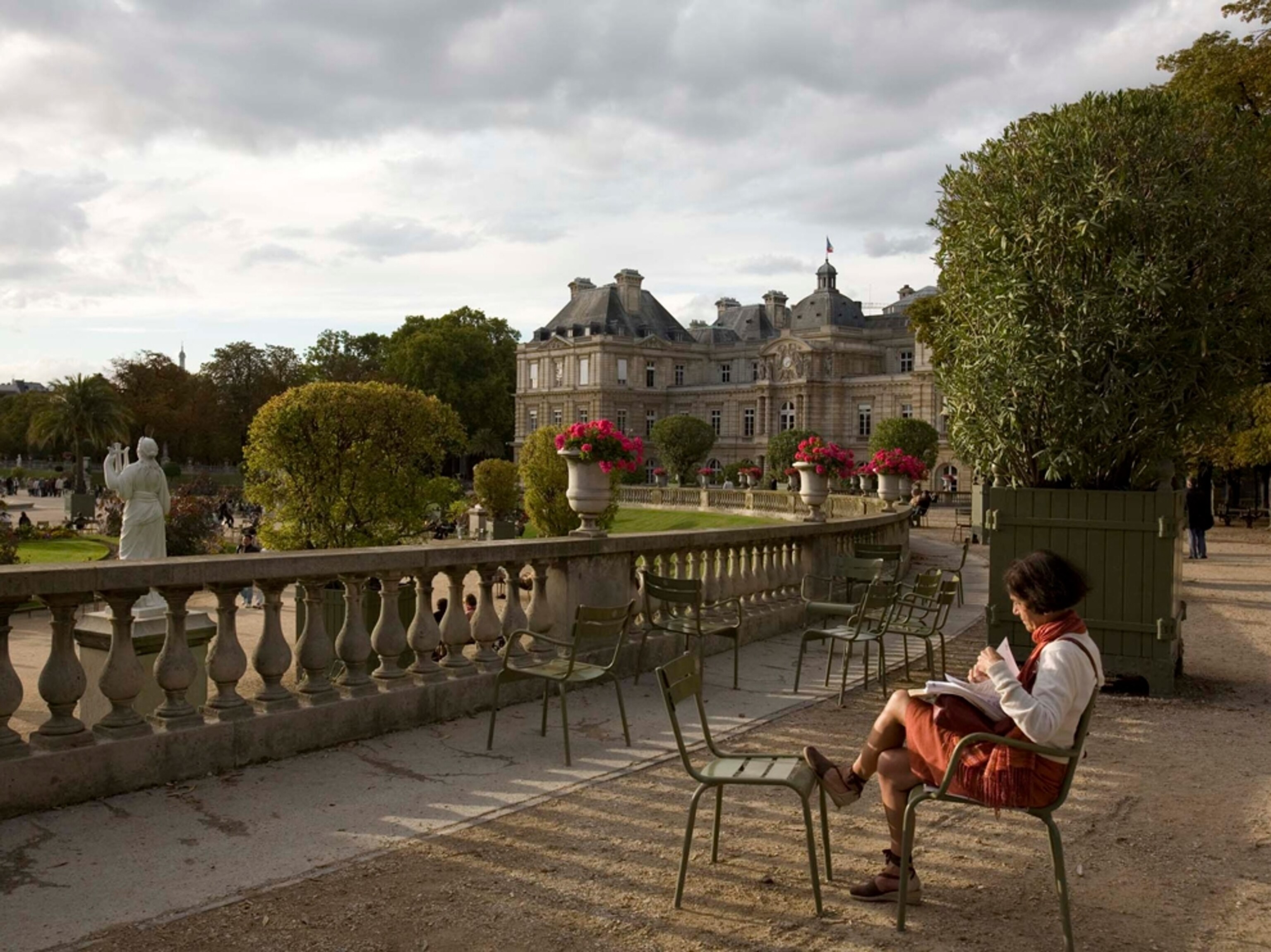 Woman reading in Luxembourg Garden, Paris, France