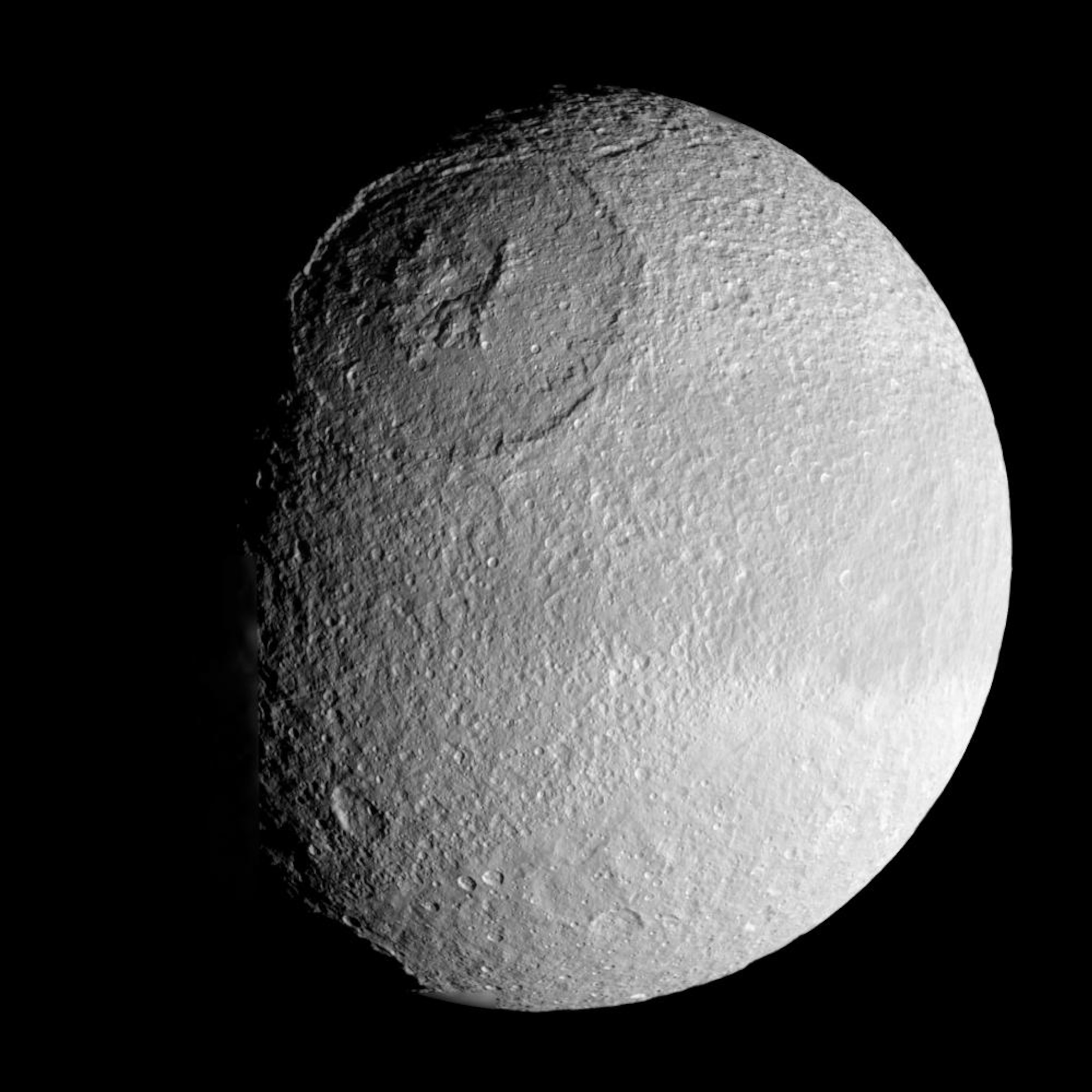 The enormous Odysseus crater on Tethys is 450 kilometers across and nearly 10 kilometers deep. (NASA/JPL-Caltech/SSI)