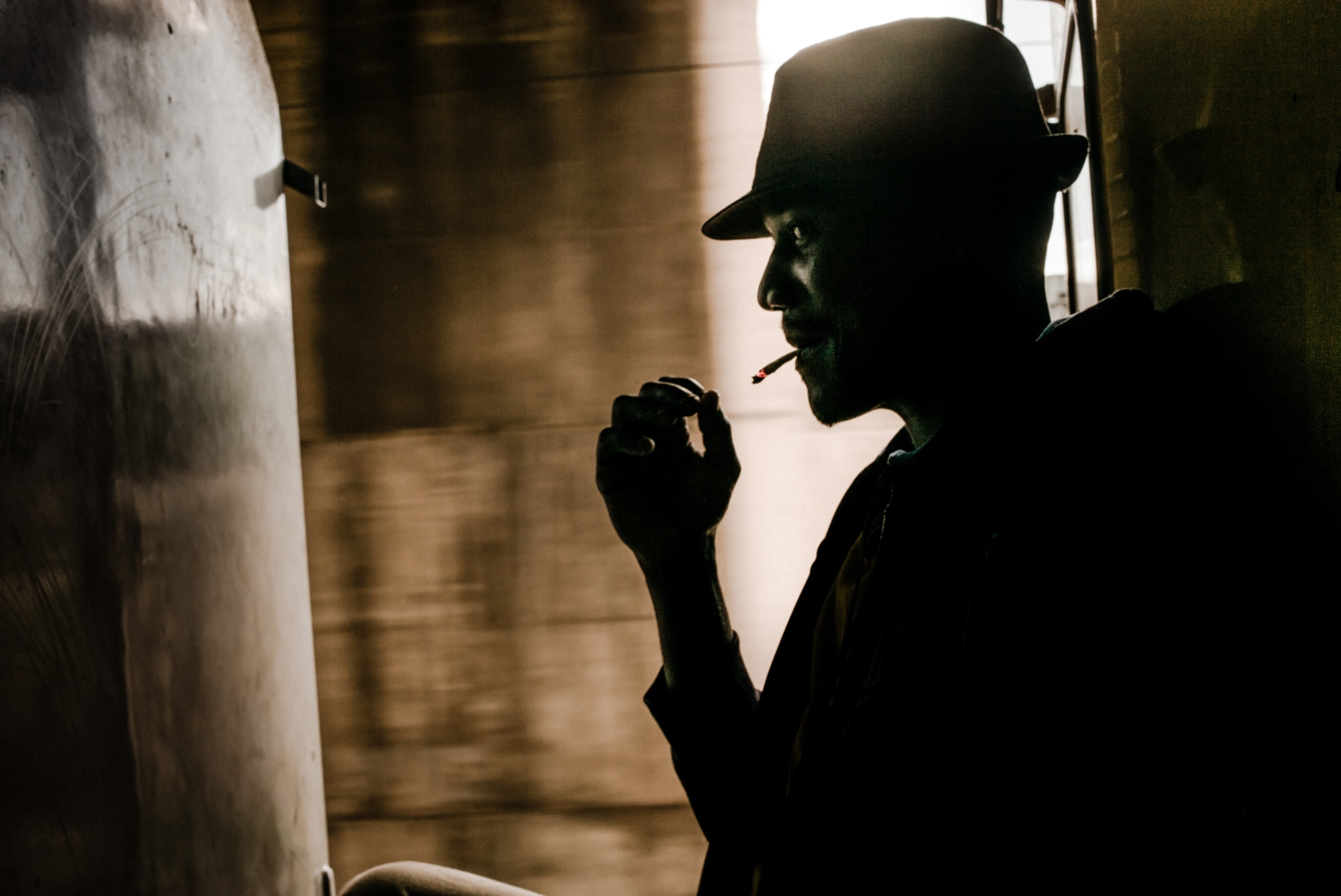 a young man smoking on a train.