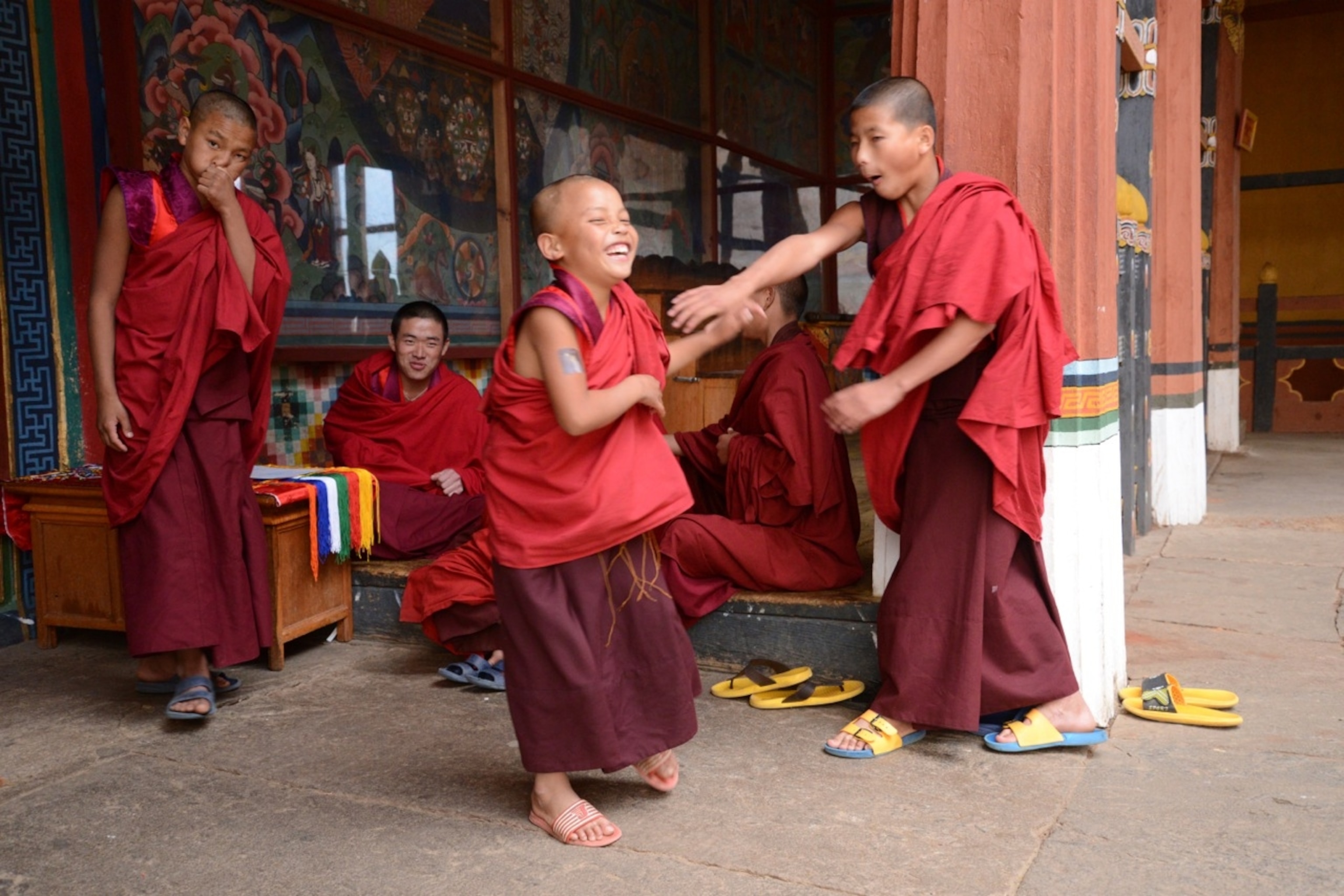 Young monks play in the courtyard of Dzong Rinpung in Paro, Bhutan (Photo by Andrew Evans, National Geographic)