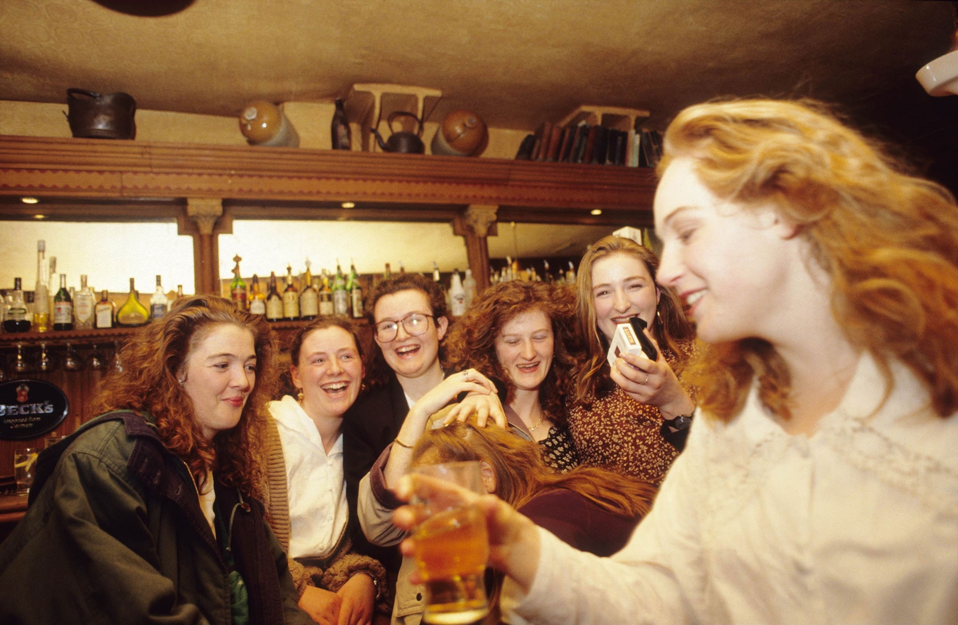 A group of women with red hair drink together