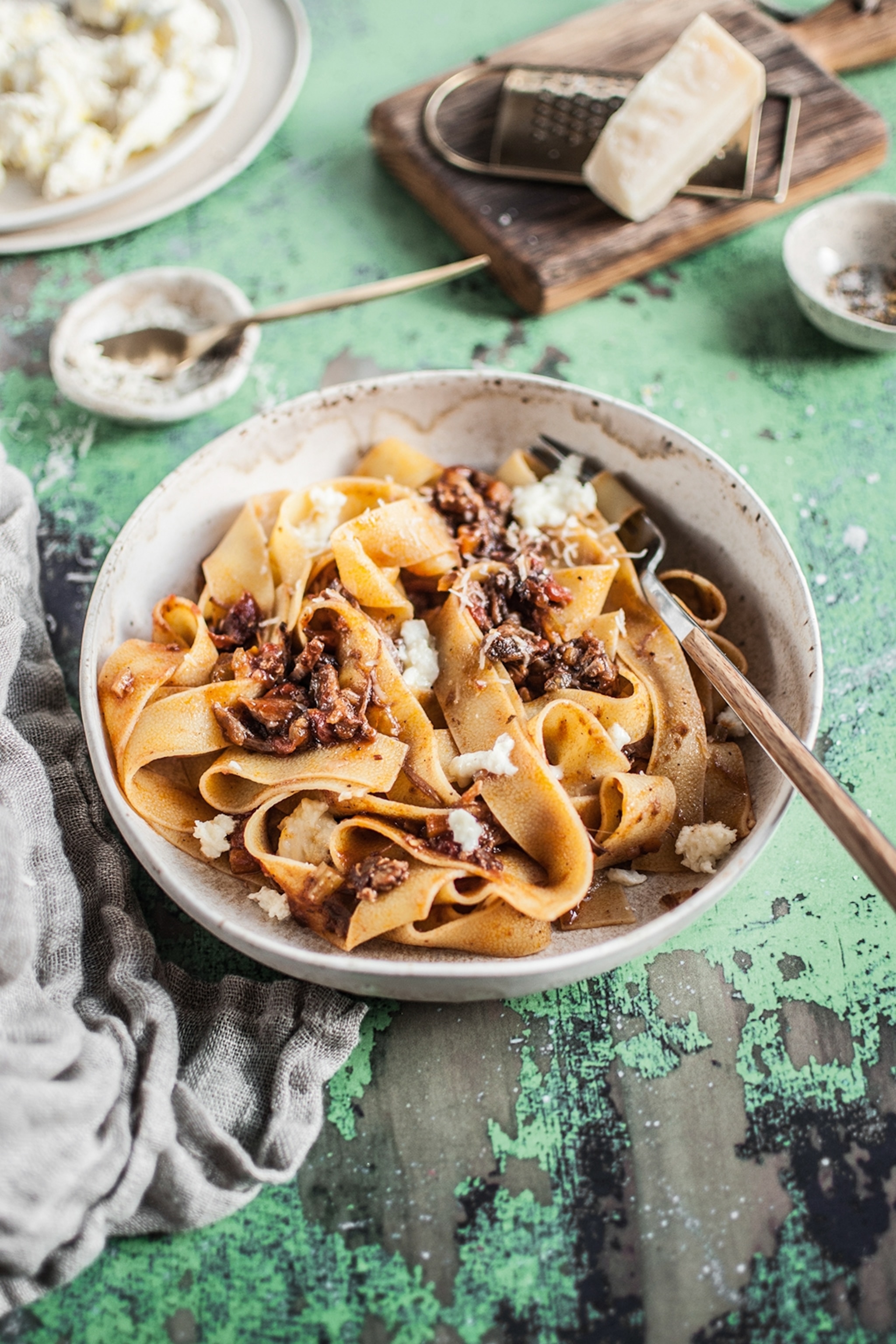 A plate of tagliatelle with ragu sauce.