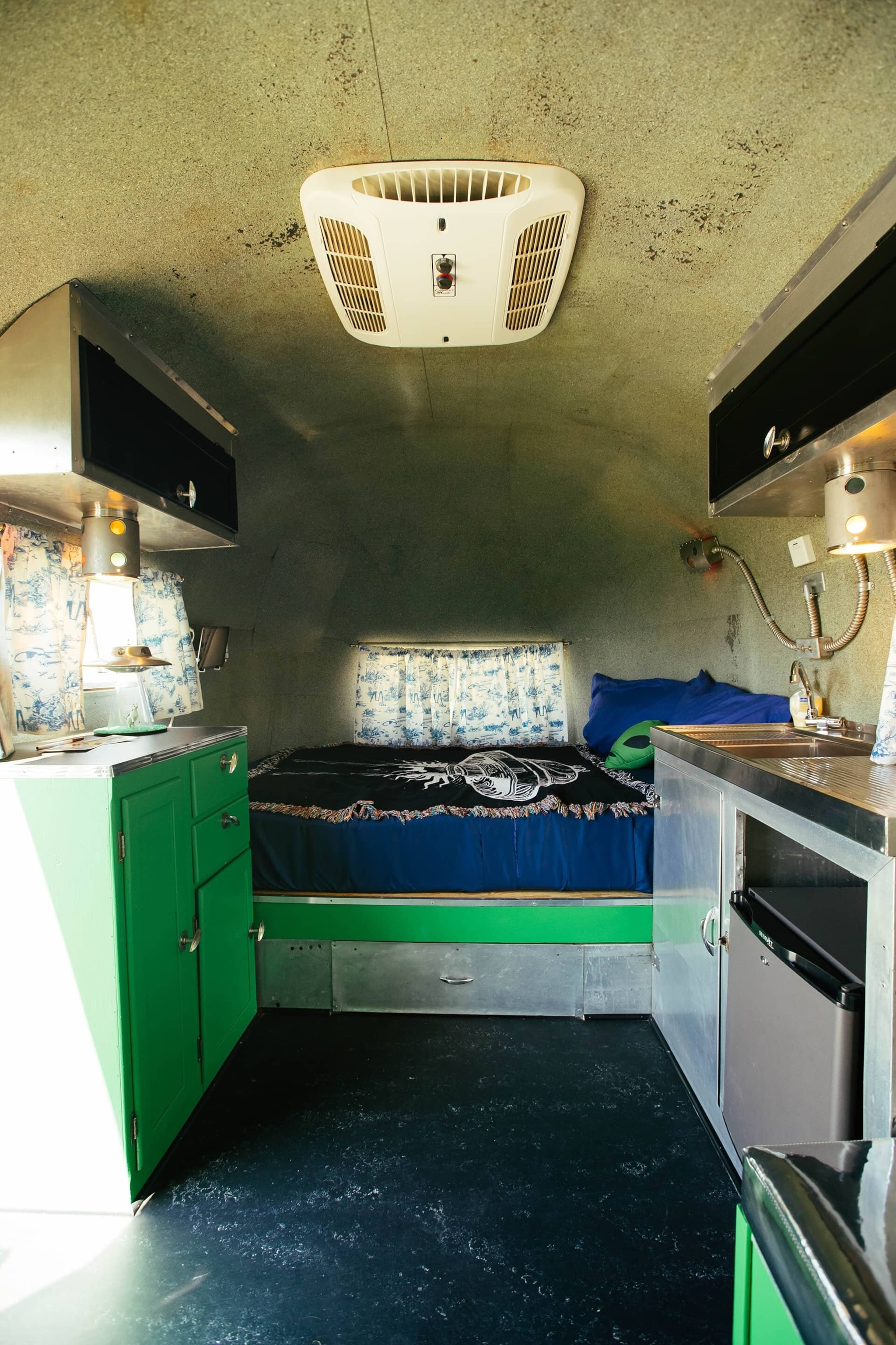 Interior of an alien and space themed airstream.