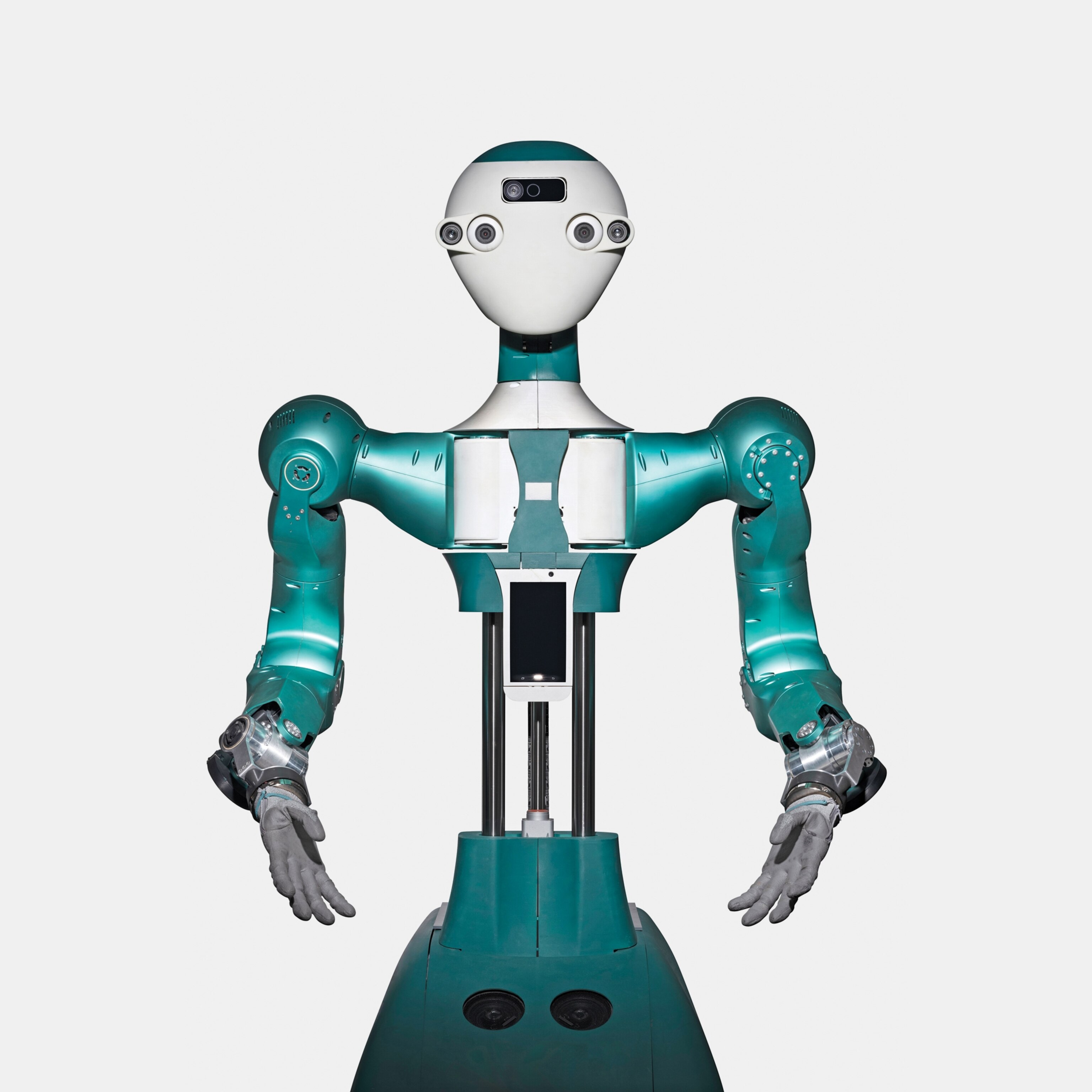 A humanoid robot with teal body and white head, featuring multiple cameras as eyes, stands with arms extended.