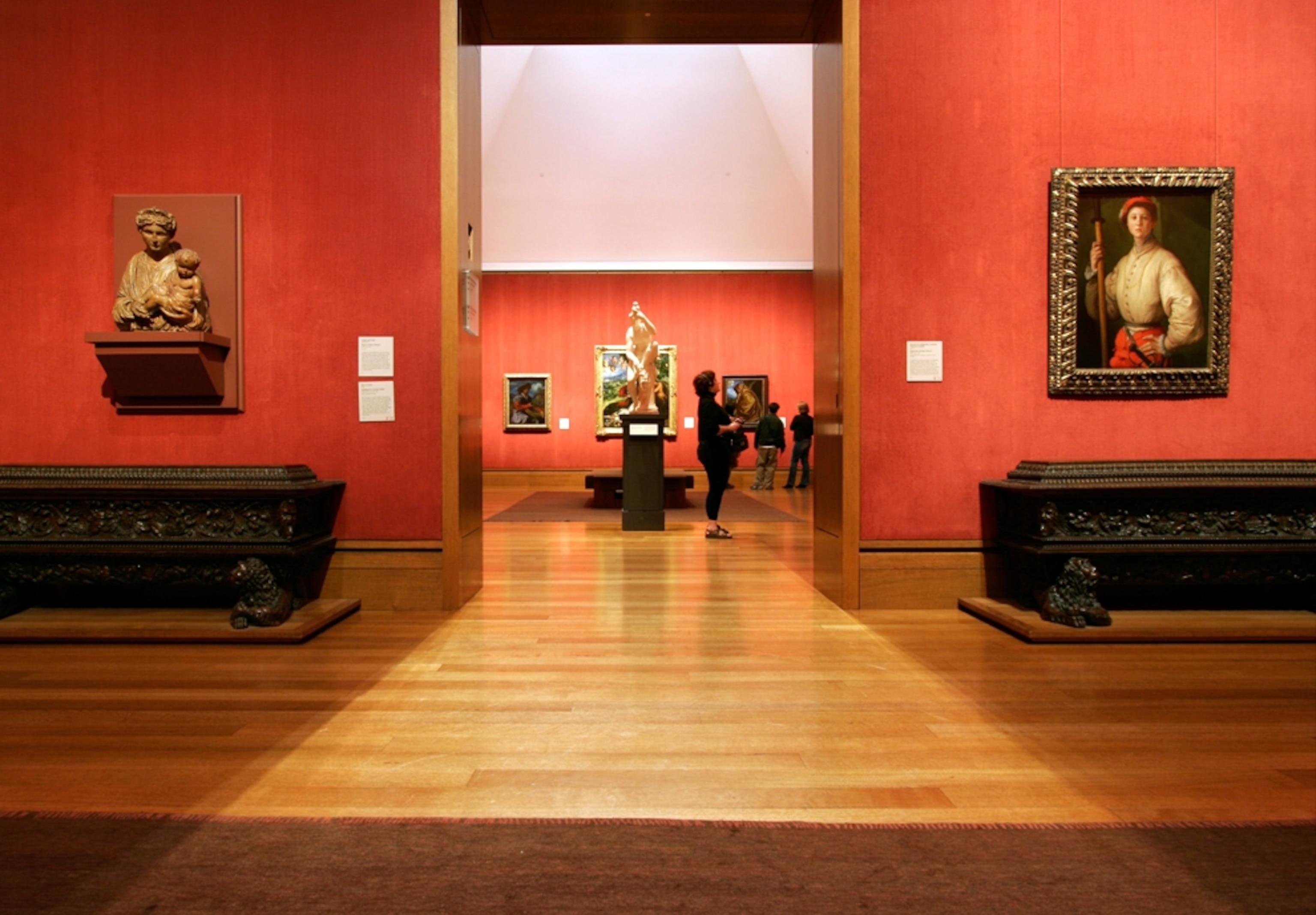 visitors looking at art in museum