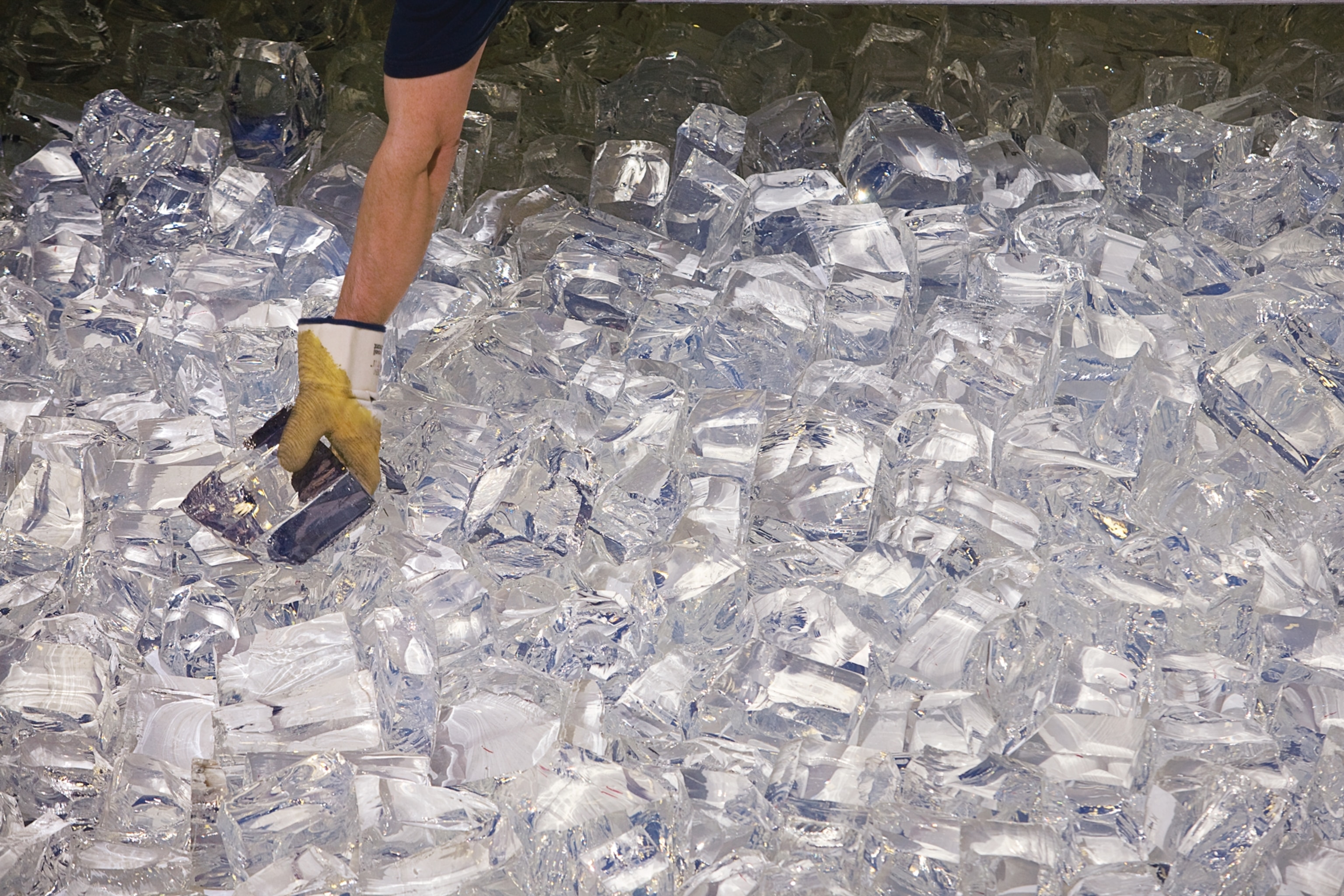 ten-pound glass chunks being loaded into a honeycombed mold at the University of Arizona