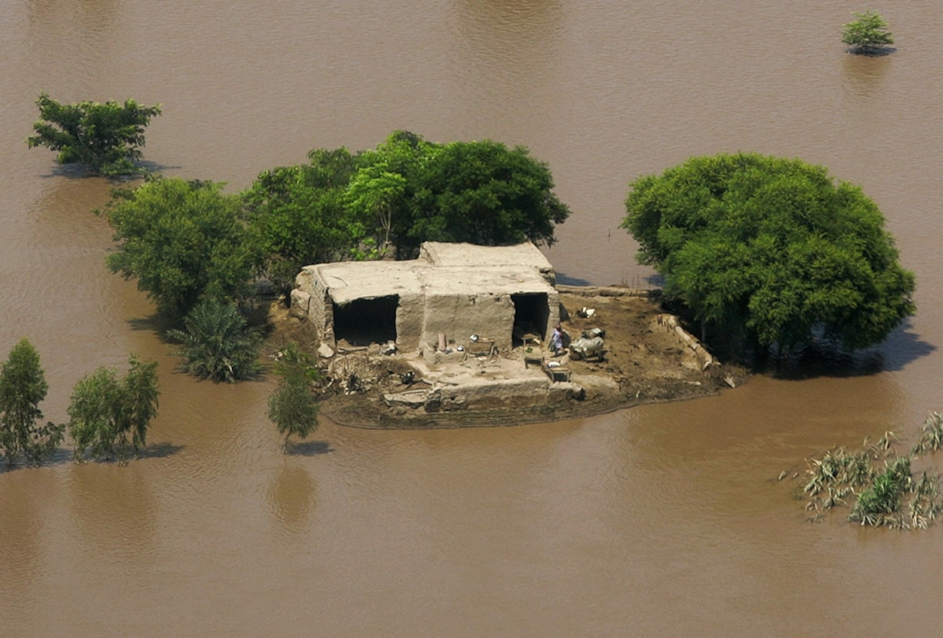 a house isolated by floodwaters in Pakistan