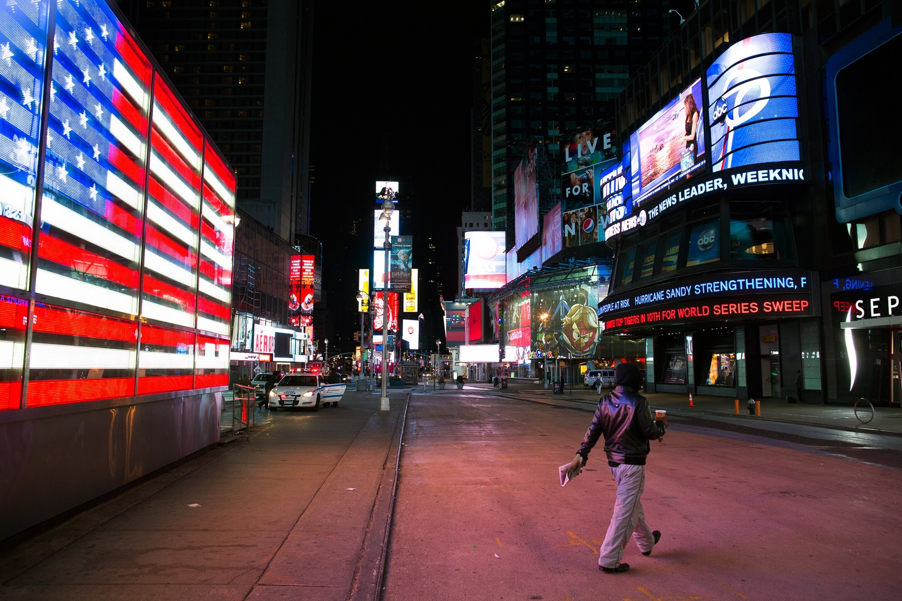 a person walking through Times Square