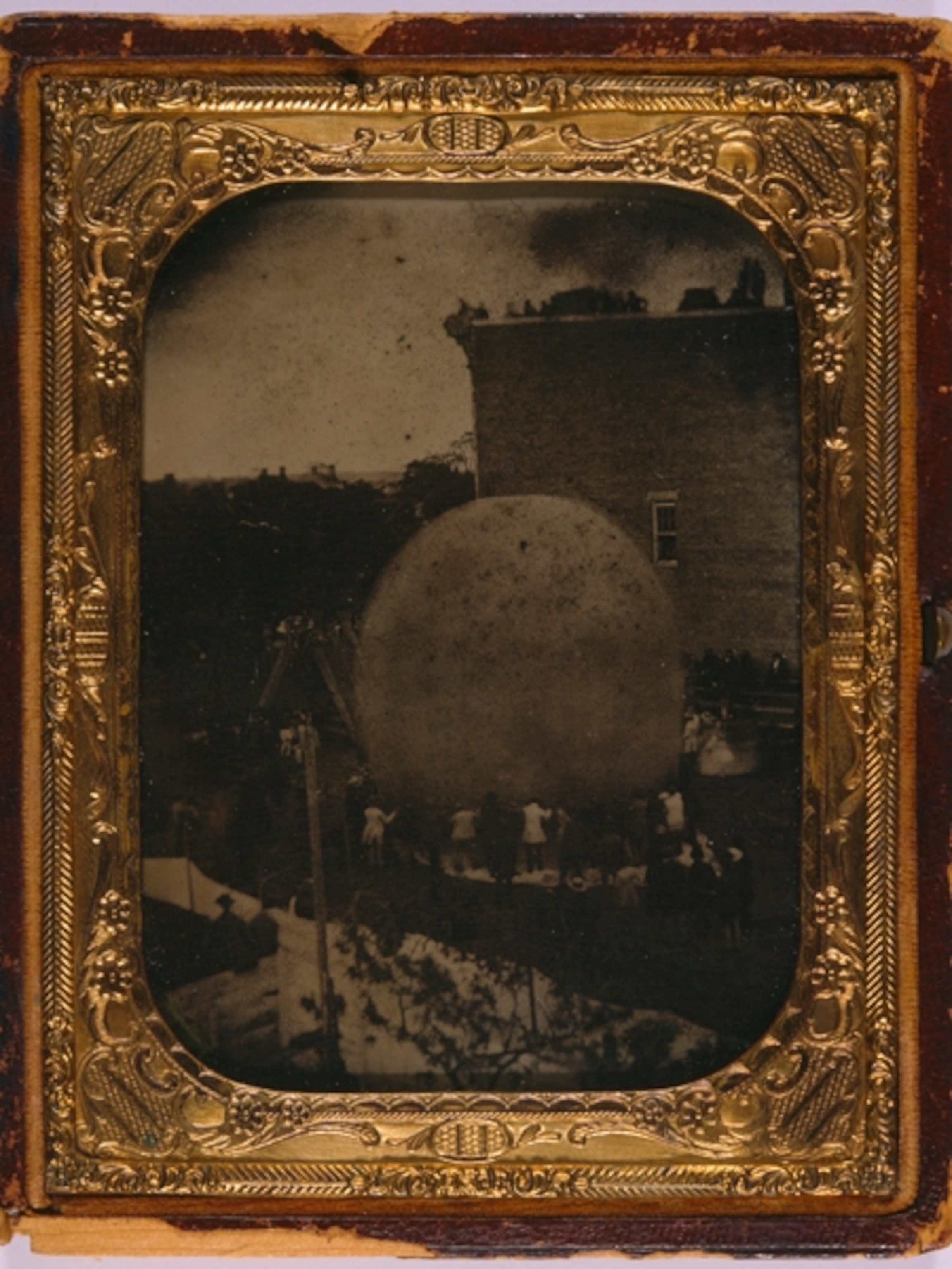 a 19th-century hot air balloon being inflated.