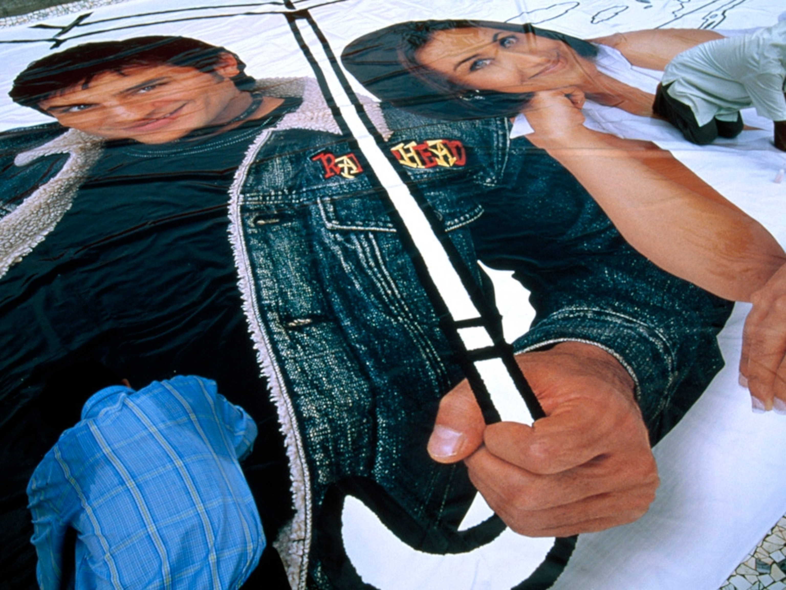 A man pastes a poster