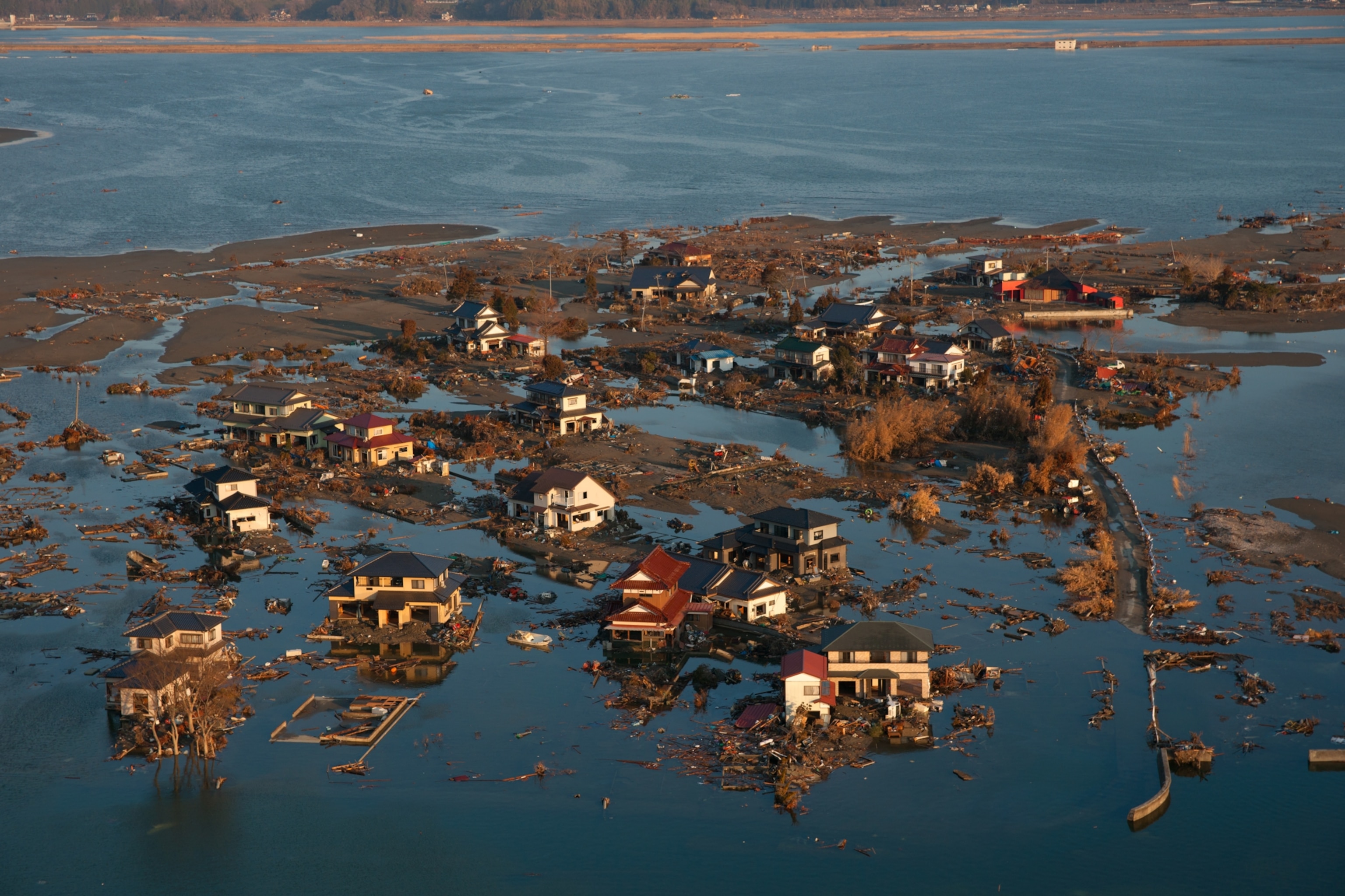 An aerial view showing flooded and destroyed houses of Ishinomaki, Japan, following the 2011 earthquake and tsunami.