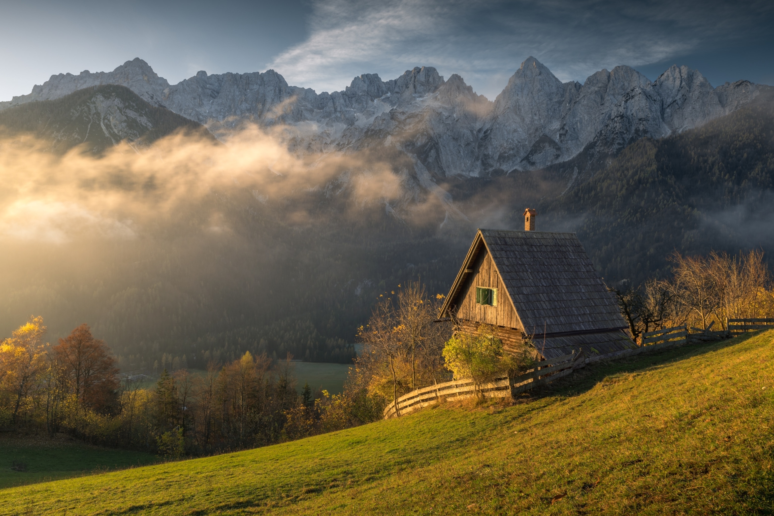 This photo was taken just after sunrise in Srednji Vrh, Slovenia. The first light of the day gently touched a small wooden house and part of the valley, while the surrounding mountains remained in shadow. I was drawn to the quiet contrast between light and shade, a simple, peaceful moment that captures the calm beauty of the morning in the Julian Alps.