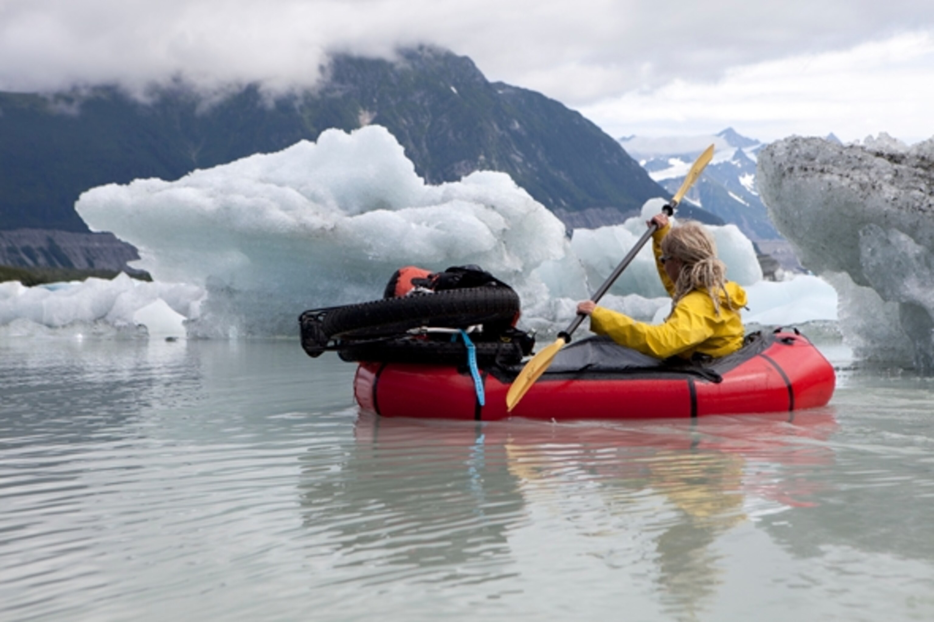 Mt. Fairweather is the backdrop to this pristine mountain lake choked with icebergs. We spent some time exploring these icy giants in our Alpacka rafts; Photograph by Cameron Lawson